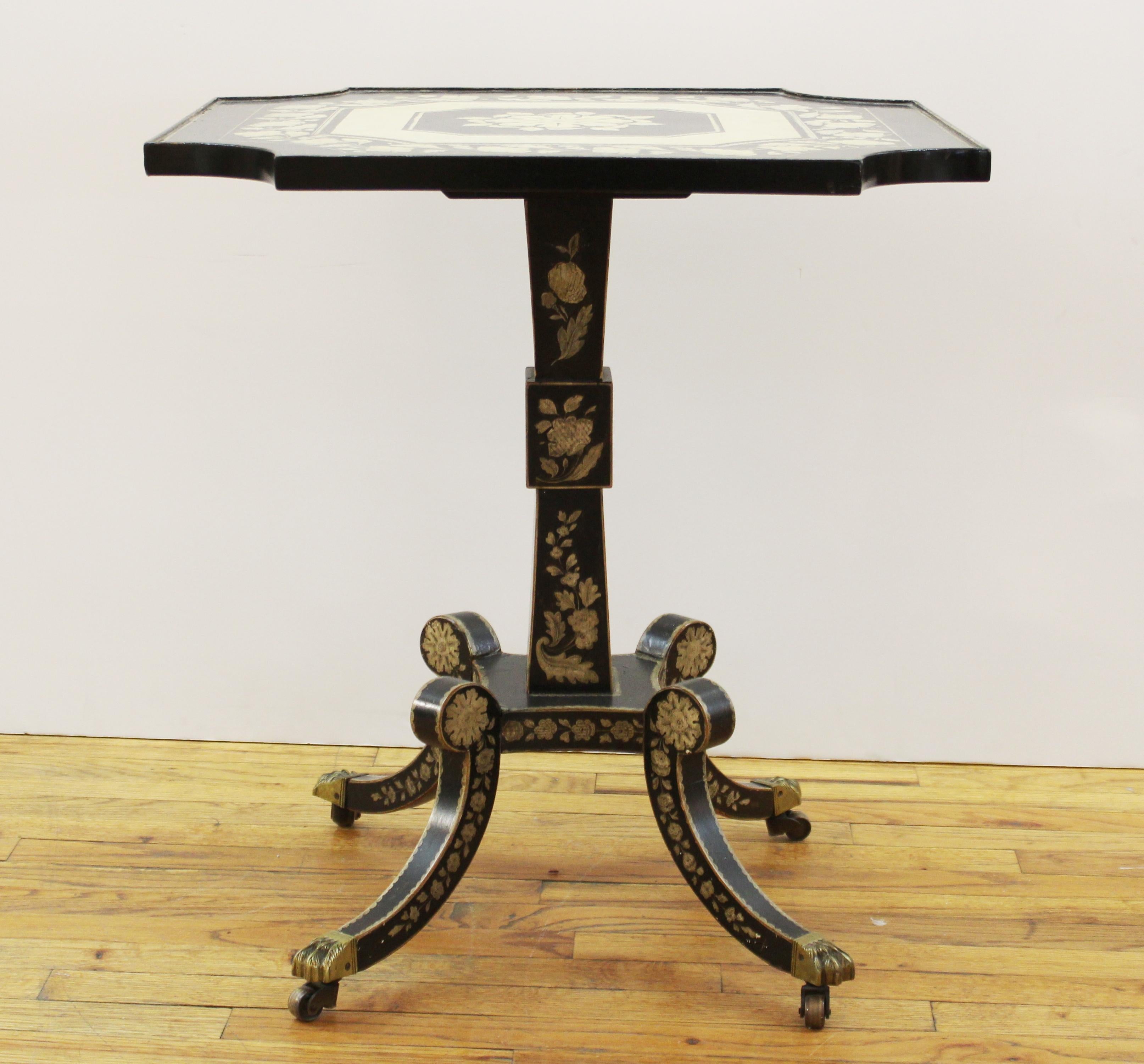 English Regency style penwork embellished side table in wood, on casters, with square top. In great vintage condition with age-appropriate wear and use.