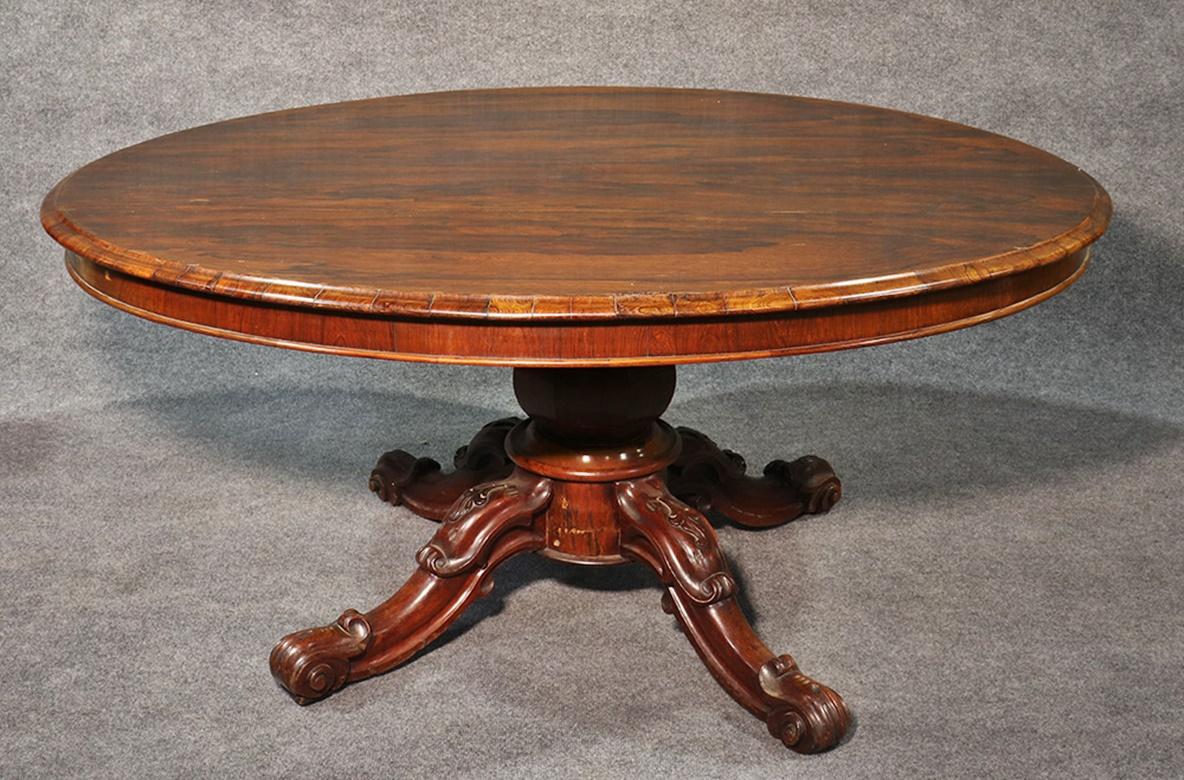 This is a very large rosewood tilting breakfast table. Designed in the English regency style, this 1860s era table is in good original condition and has some signs of age and use as one would expect. This is a great table.