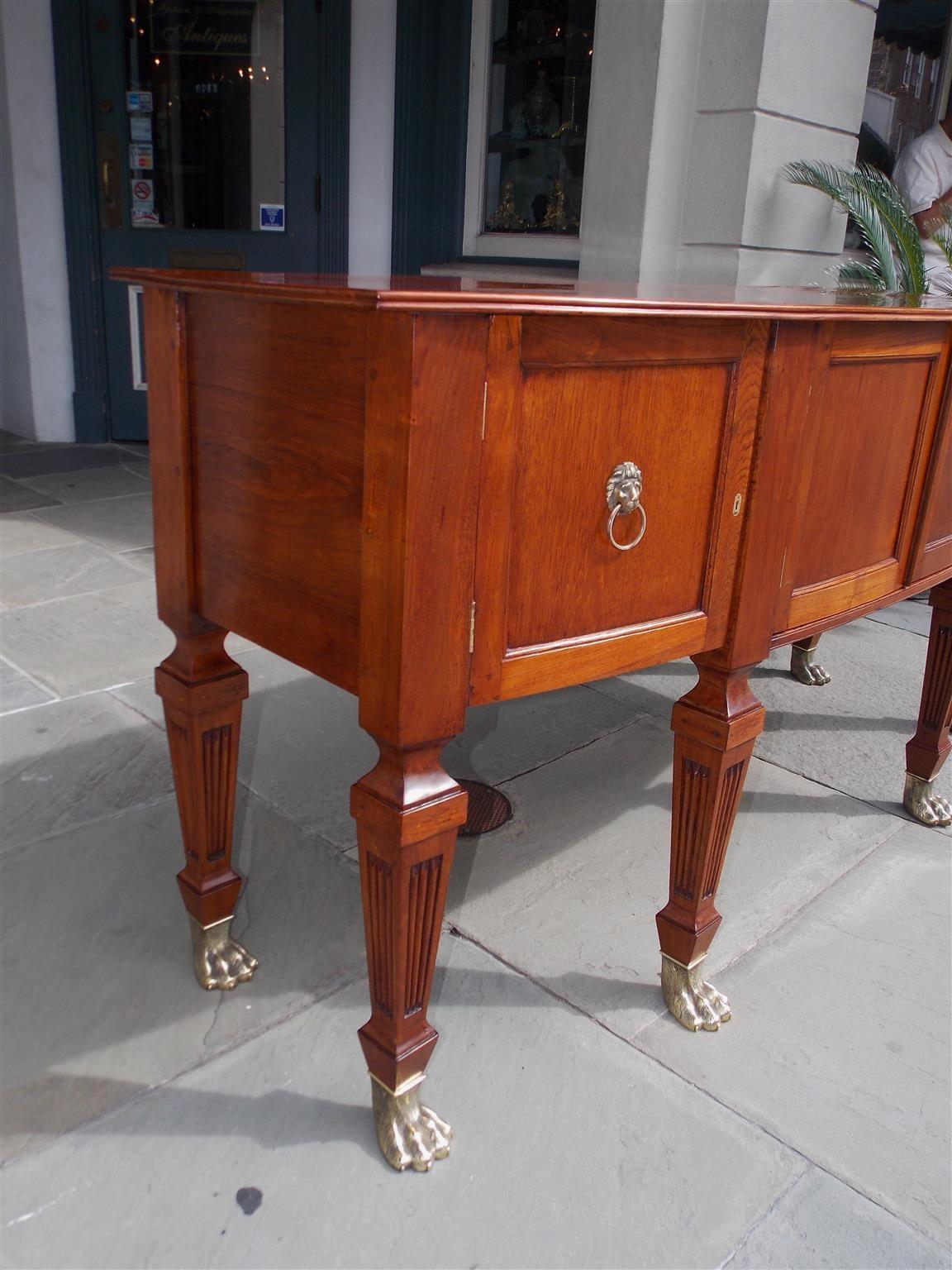 Hand-Carved English Regency Style Teak Bow Front and Brass Hairy Paw Sideboard, Circa 1870 For Sale
