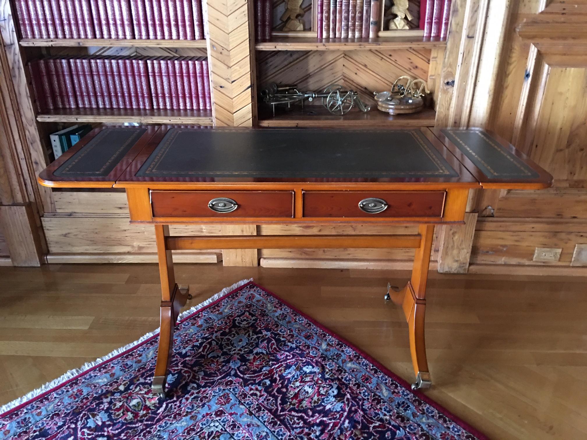 English Regency style walnut sofa or desk table with a leather top, 20th century.  Width is 38