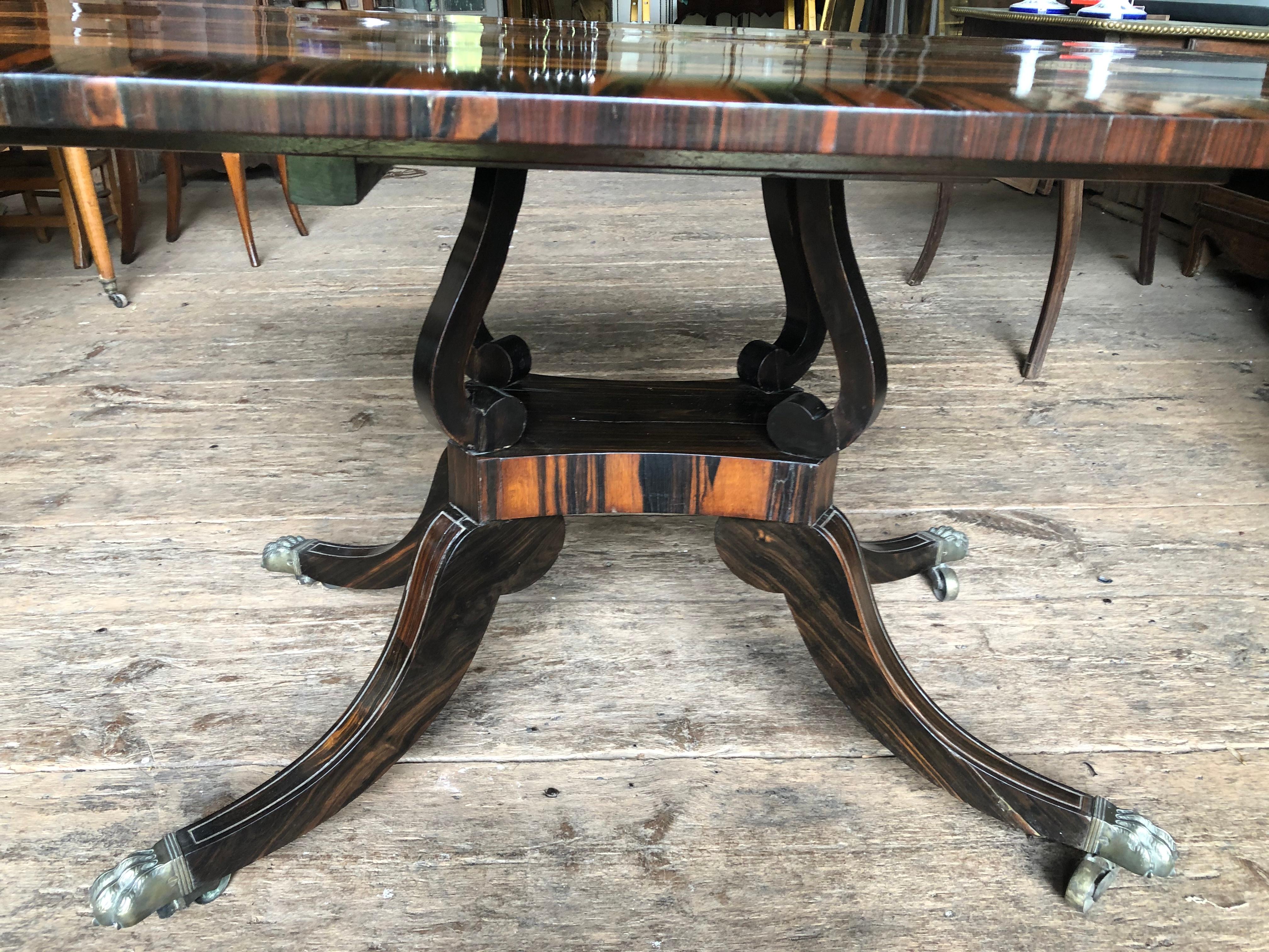 An English Regency tilt-top tea table, circa 1820, in Calamander wood veneer, with a four leg 