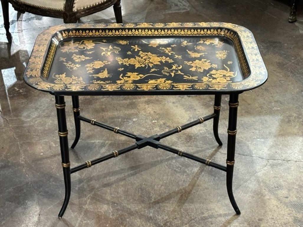 Early 20th century Regency style black lacquer and gilt tray table. Circa 1920.A fine addition to any home!