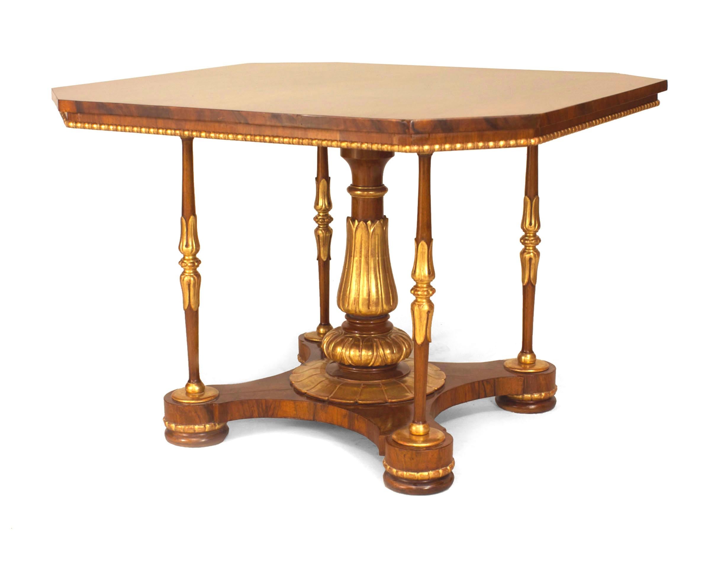 English Regency (circa 1850s) walnut & gilt trimmed center table with a square top & canted corners supported on a centered pedestal & 4 corner columns on a platform base (attributed to MOREL & SEDDON).
