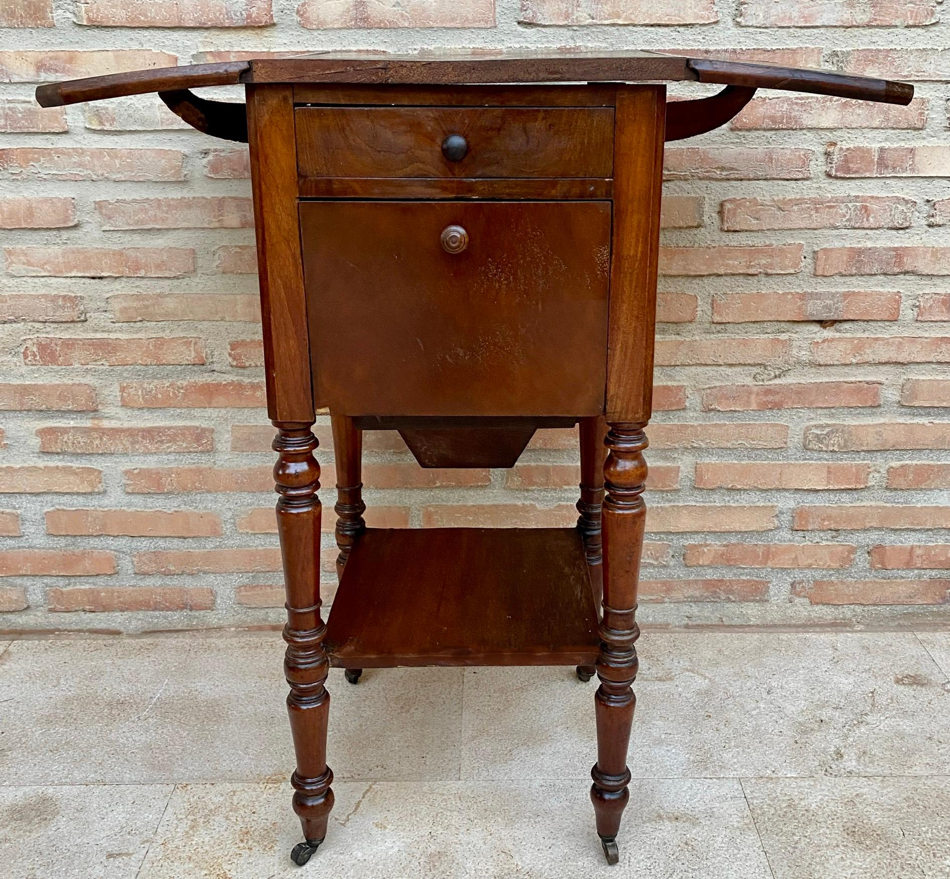 Spanish English Regency Walnut Table with Wings and Wheels, 1920s For Sale
