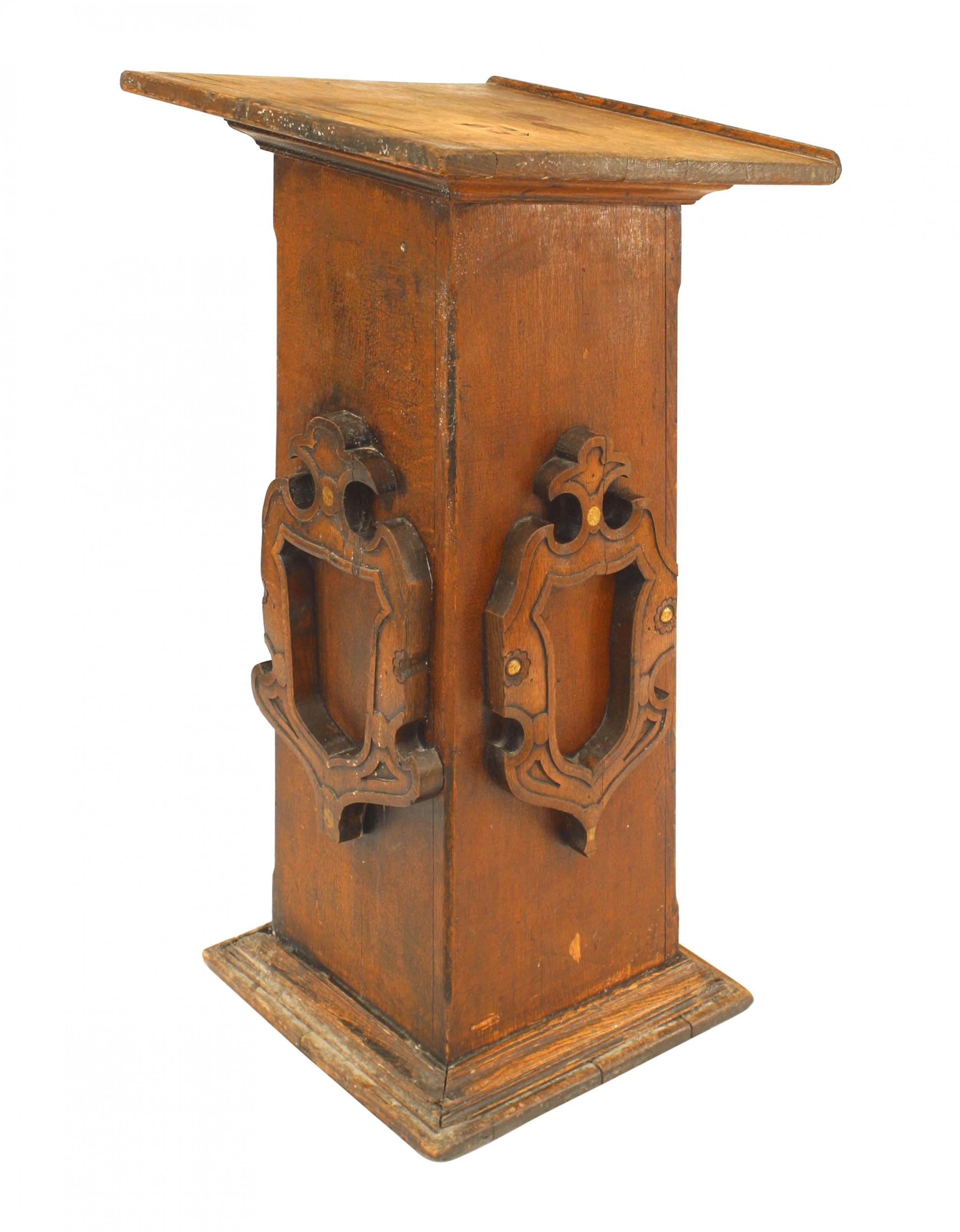English Renaissance style (19/20th Cent) stained oak square based lectern with carved shield sides.