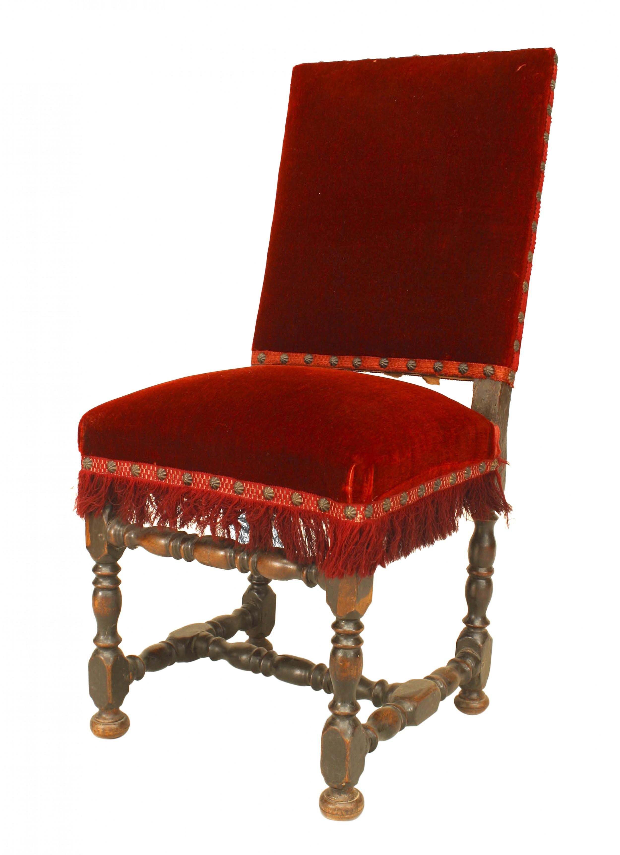 English Renaissance style oak carved side chair with a square back and stretcher with red velvet upholstered seat and back