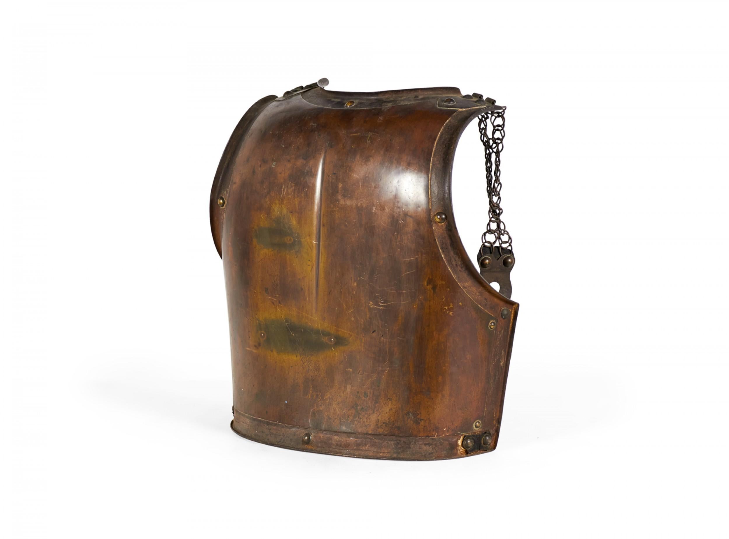 English Renaissance-style (mid-19th Century) brass and iron back breast plate of armor.

Back dimensions only. Tarnish. Breastplate front: 012539
