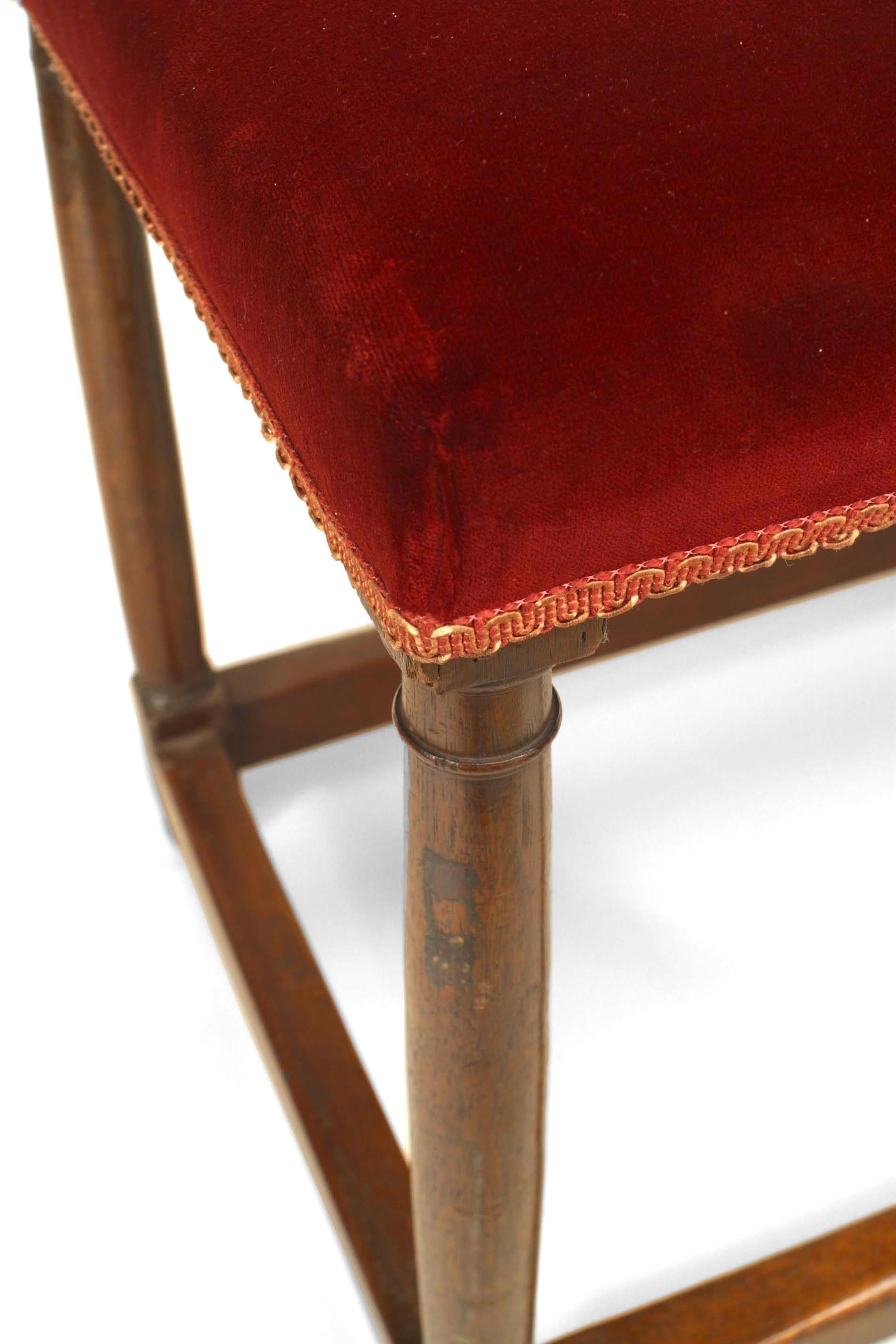 English Renaissance style (19th Century) 6 legged walnut bench with stretcher and red velvet upholstered seat.