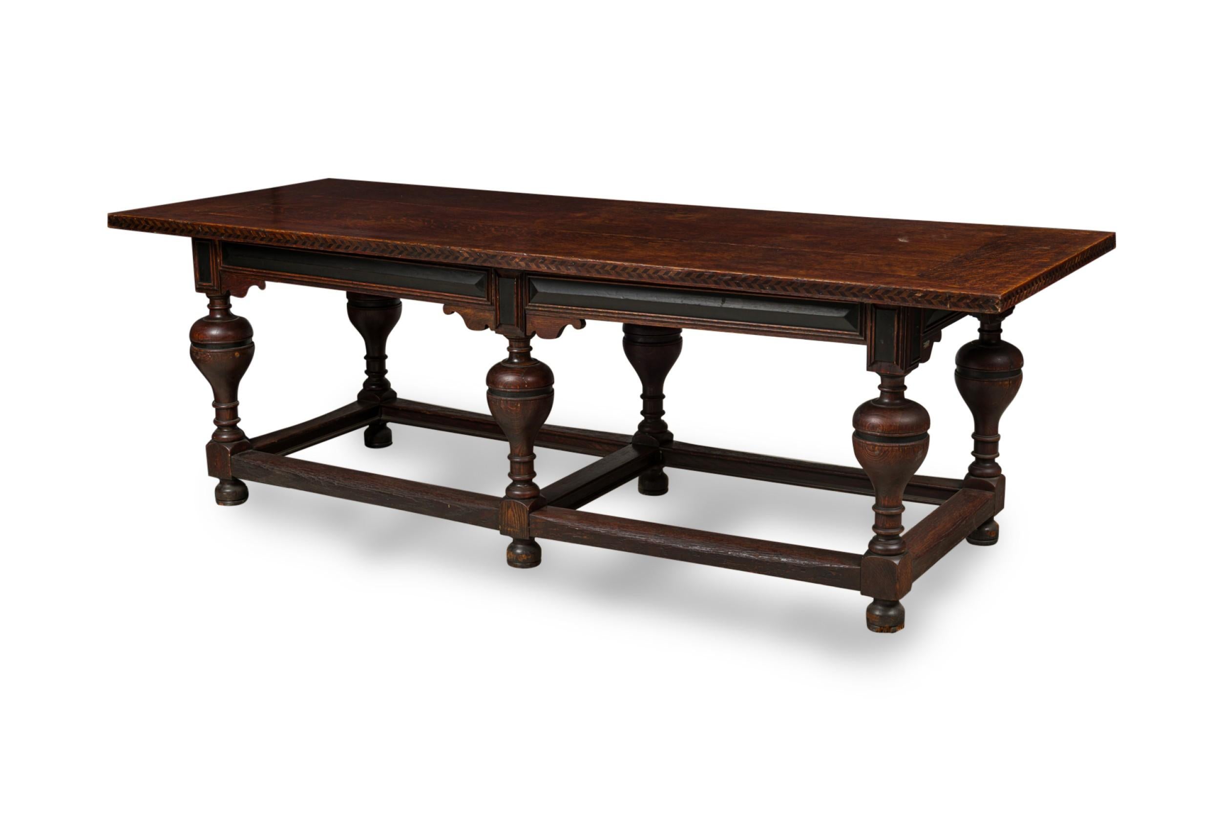English Renaissance-style (20th century) oak refectory dining/conference table with a rectangular top featuring an inlaid border around the table top edge, resting on 6 turned legs connected by a stretcher.
 

 Discoloration
