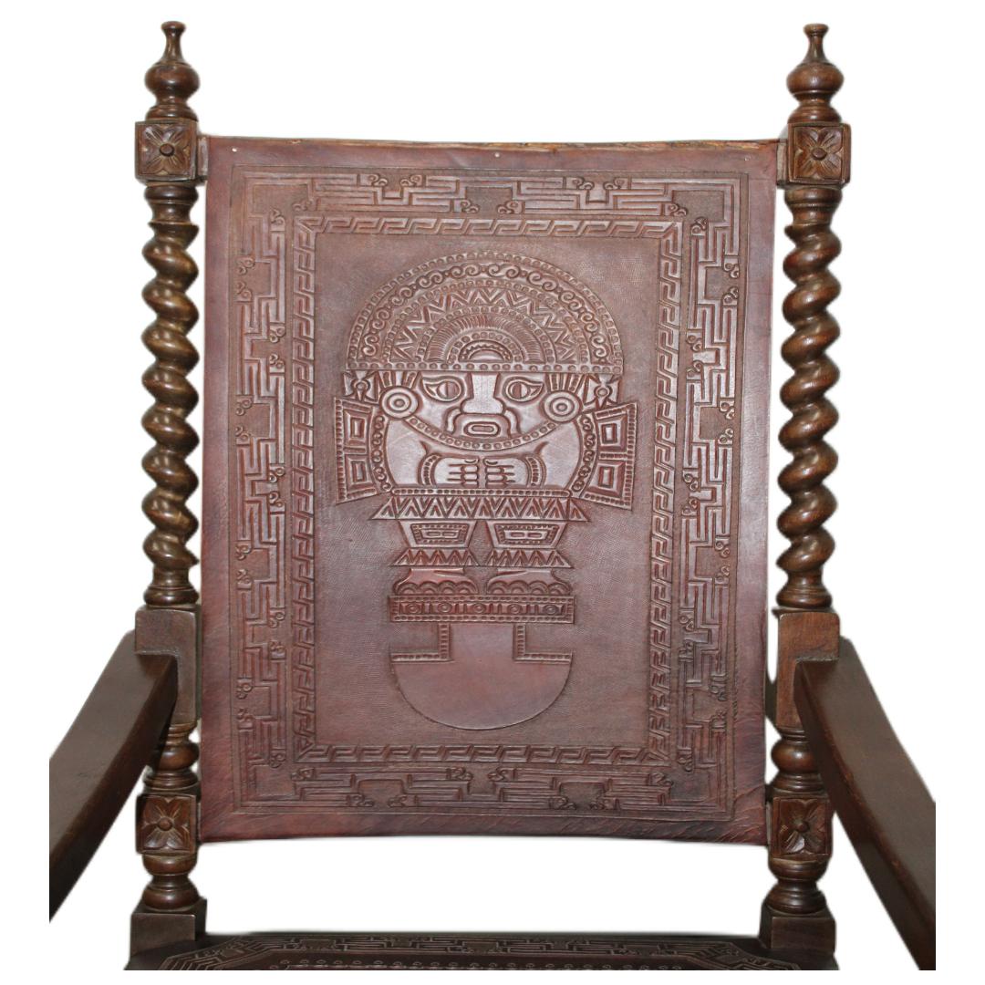 C. 20th century

Hand carved rocking chair with turned wood spindles and tooled leather seat/back w/Mayan design.