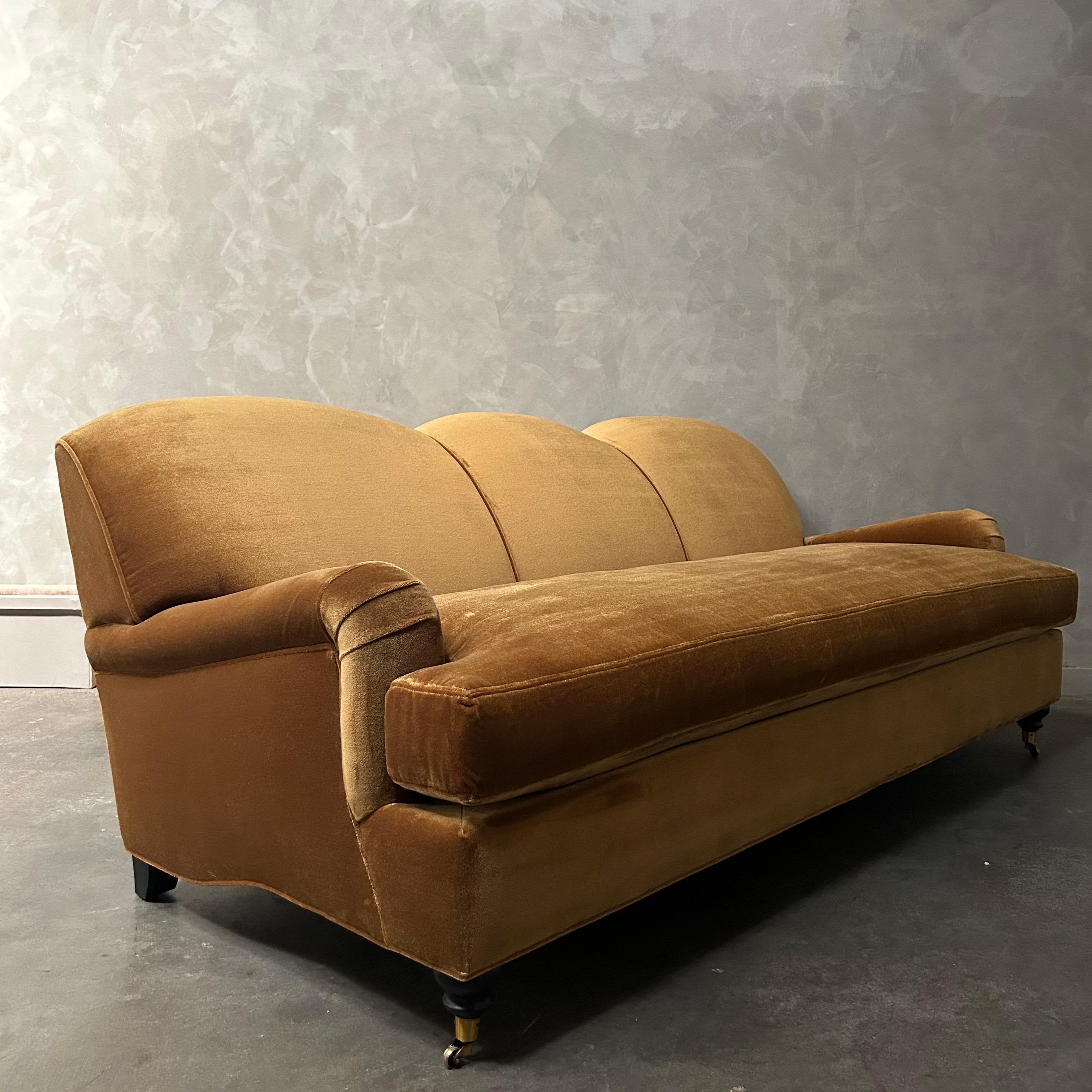 This beautiful english arm sofa has a modern twist, with its single bench cushion, and beautiful curved apron sides. It’s upholstered in a natural luxurious velvet , with down cloud cushions. Hardwood frame, no sag, HR foam, cotton, and poly fill.