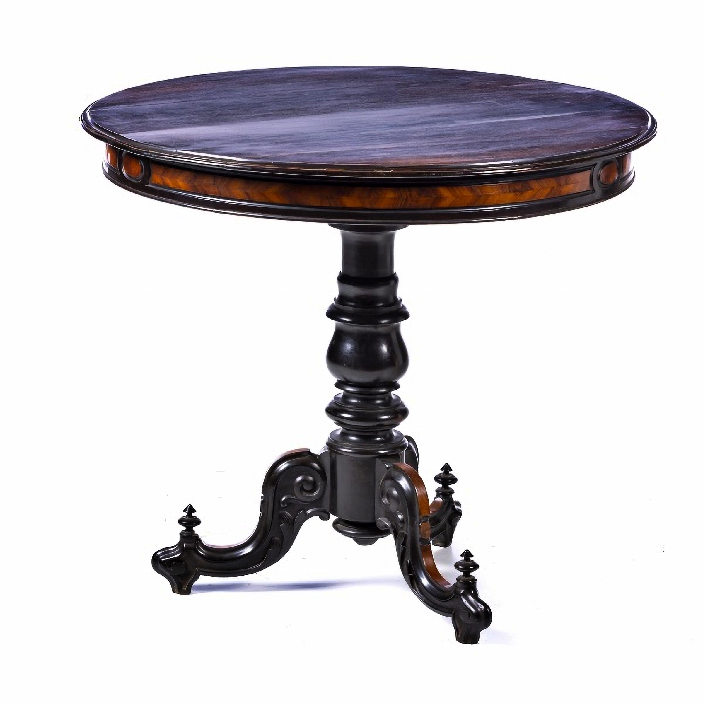 ENGLISH ROMANTIC CENTER TABLE 19th Century

in carved rosewood, circular shaped top resting on a turned central column leg, ending in three curved feet. 
Dim.: 78 x 88 x 88 cm.
good conditions