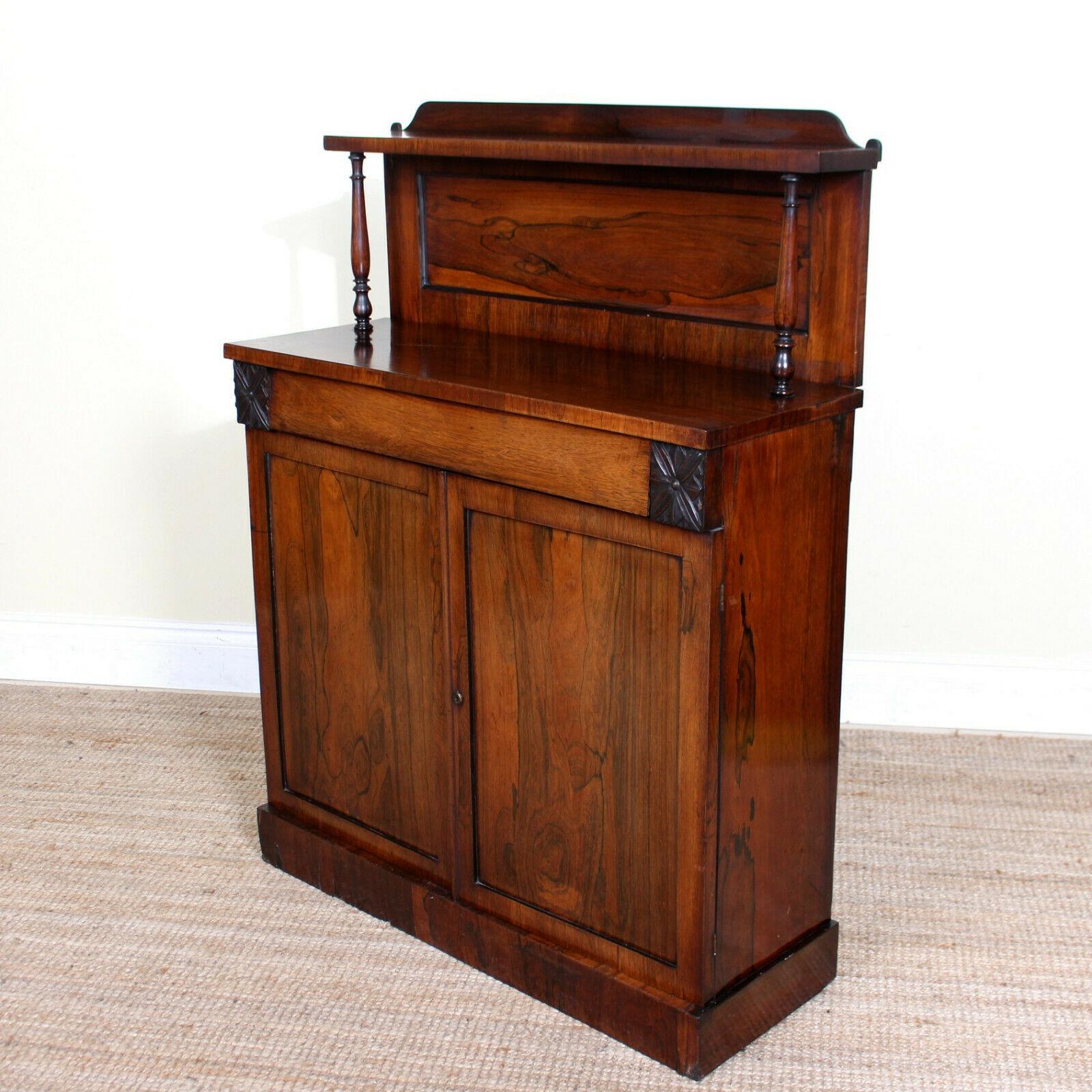 An impressive 19th century petite rosewood chiffonier.
The rosewood Marquetry inlays boasting a well figured grain and rich patina.
The upstand raised on slender turned columns above the main body fitted a long drawer with dovetailed jointing and