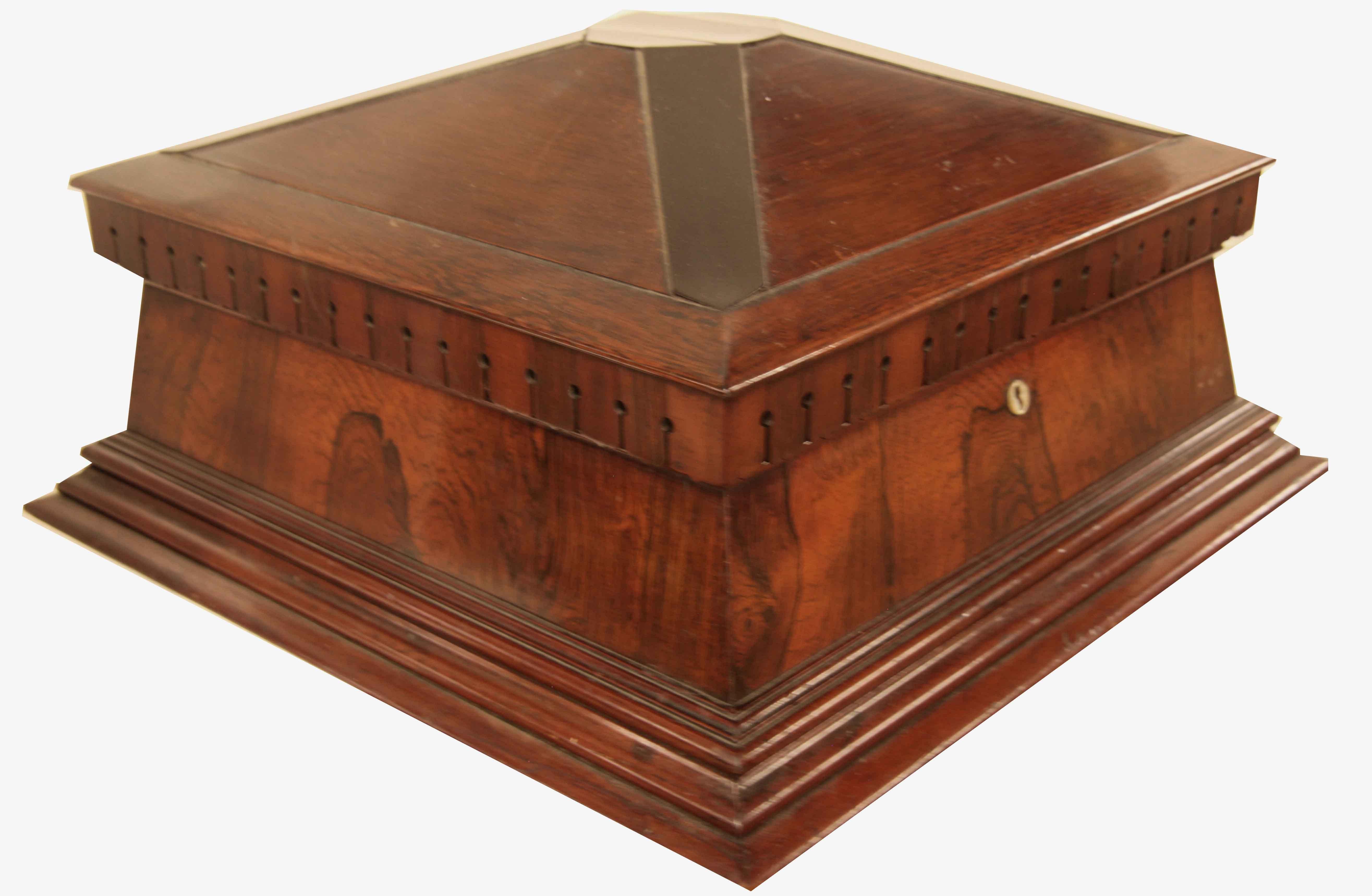 English rosewood fitted dressing box, the top is angled up on all four sides, top features an octagonal ebony center piece with tapering ebony inlays coming down from each corner. an interesting dentil molding is below .  All sides have vertical