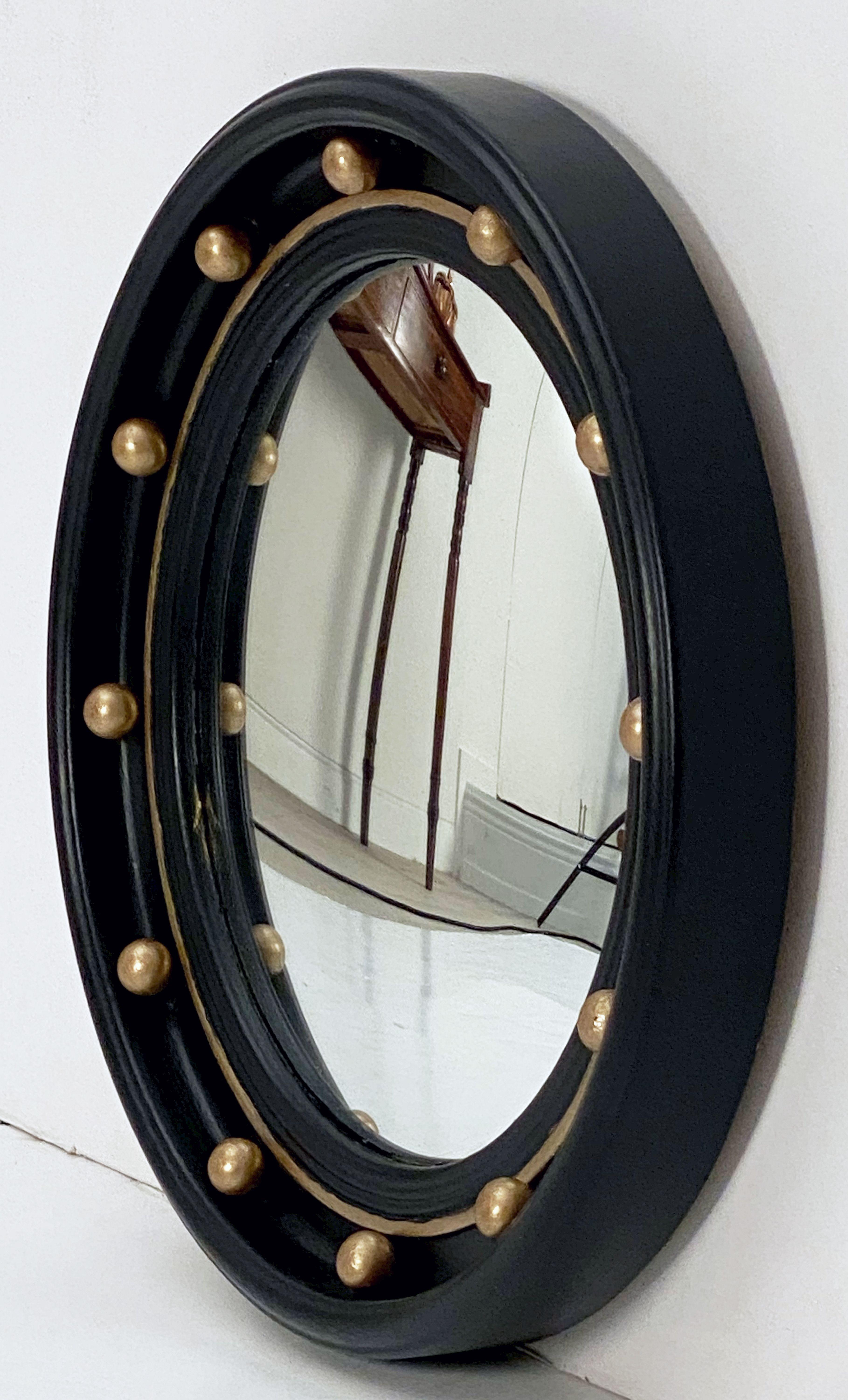 black and gold convex mirror