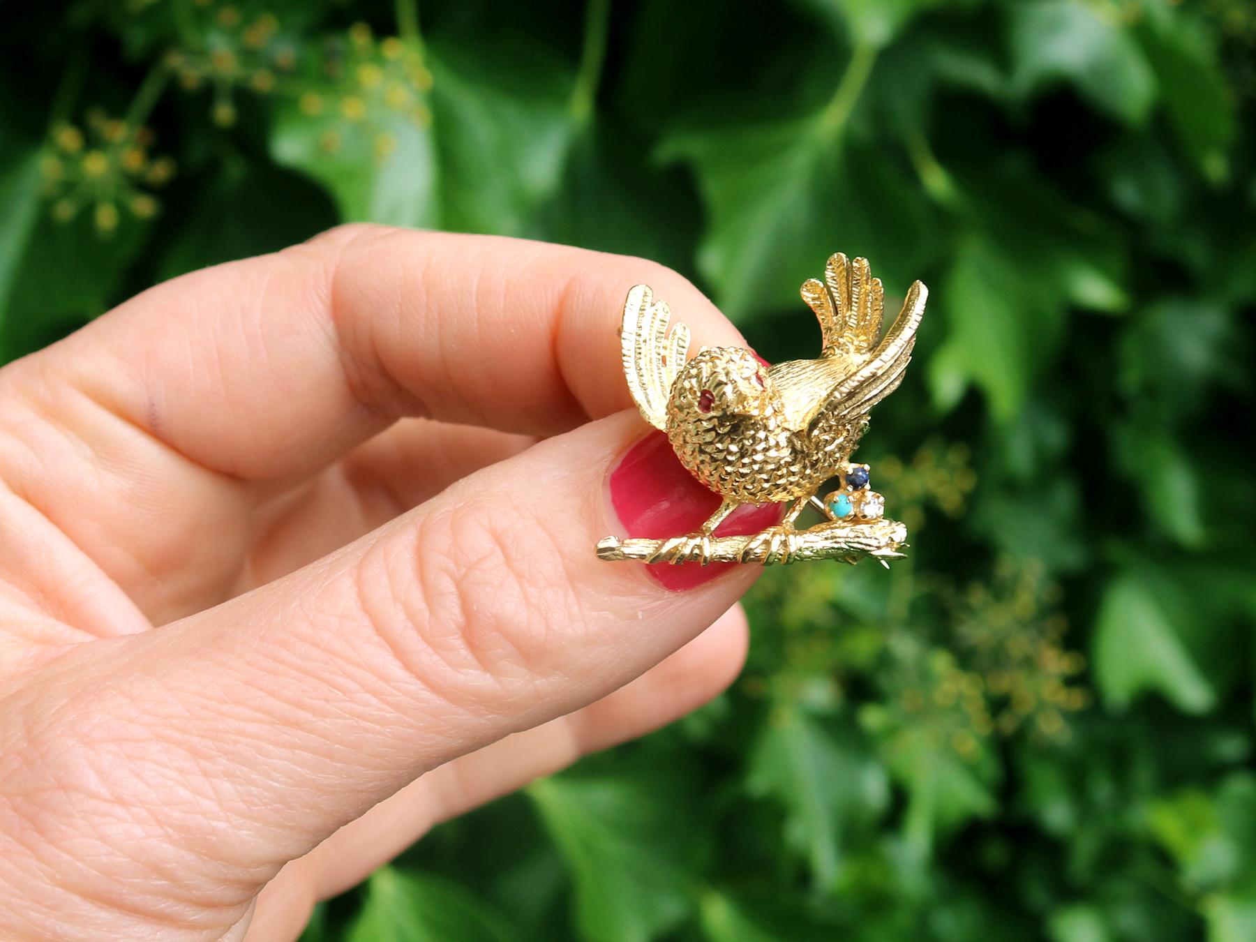 A fine and impressive vintage English 0.04 carat ruby, 0.02 carat sapphire, 0.02 carat turquoise and 0.02 carat diamond, 18 karat yellow gold bird brooch; part of our diverse vintage jewelry collections.

This fine and impressive multi-gem vintage