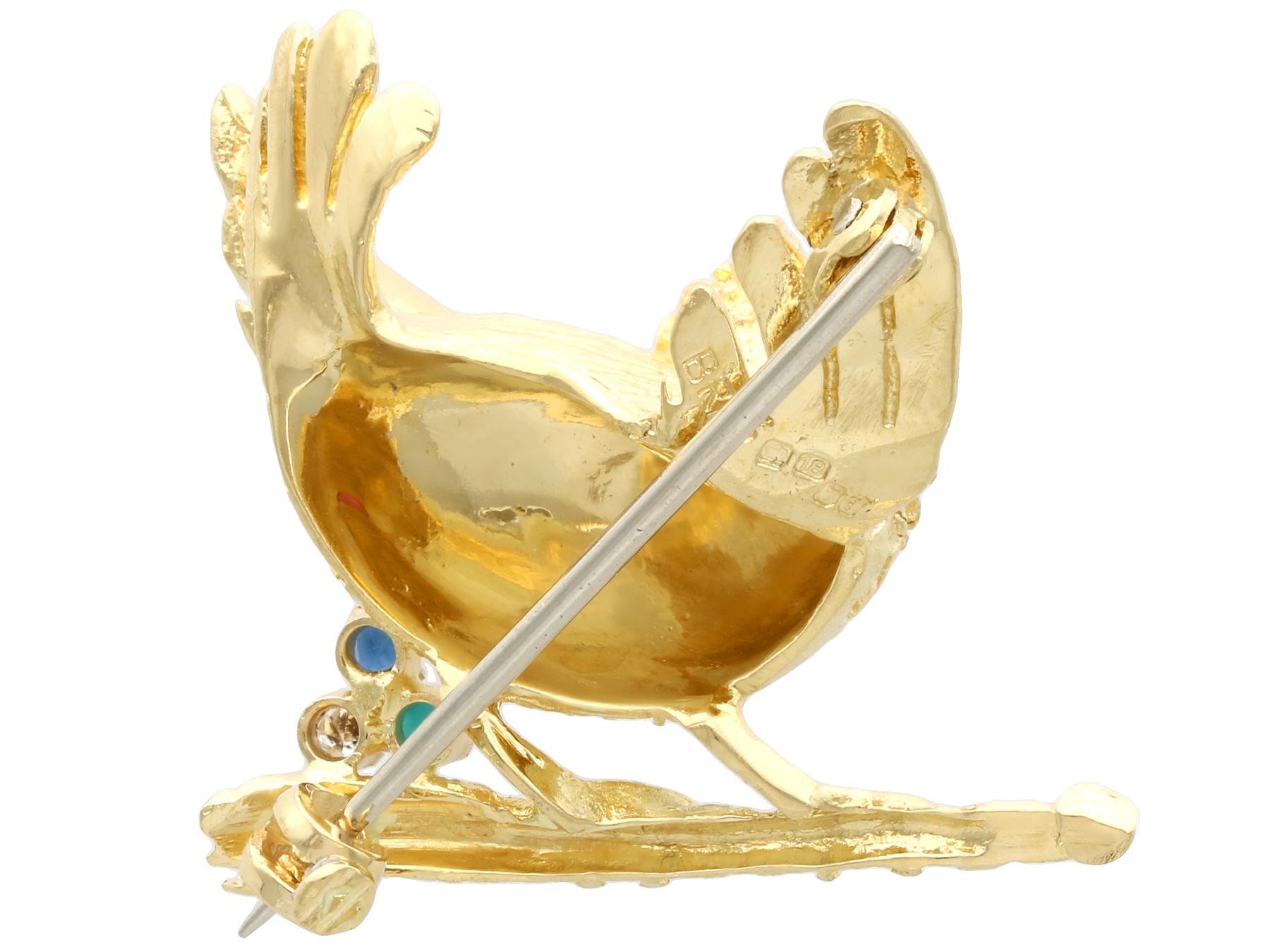 Women's or Men's English Ruby Sapphire Turquoise Diamond Yellow Gold Bird Brooch, 1971 For Sale