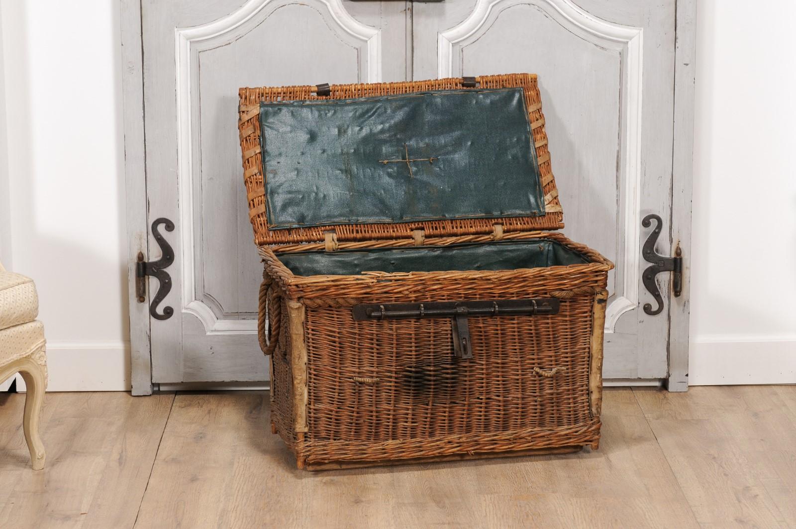 Metal English Rustic 1930s Wicker Trunk with Iron Hardware and Lateral Handles For Sale