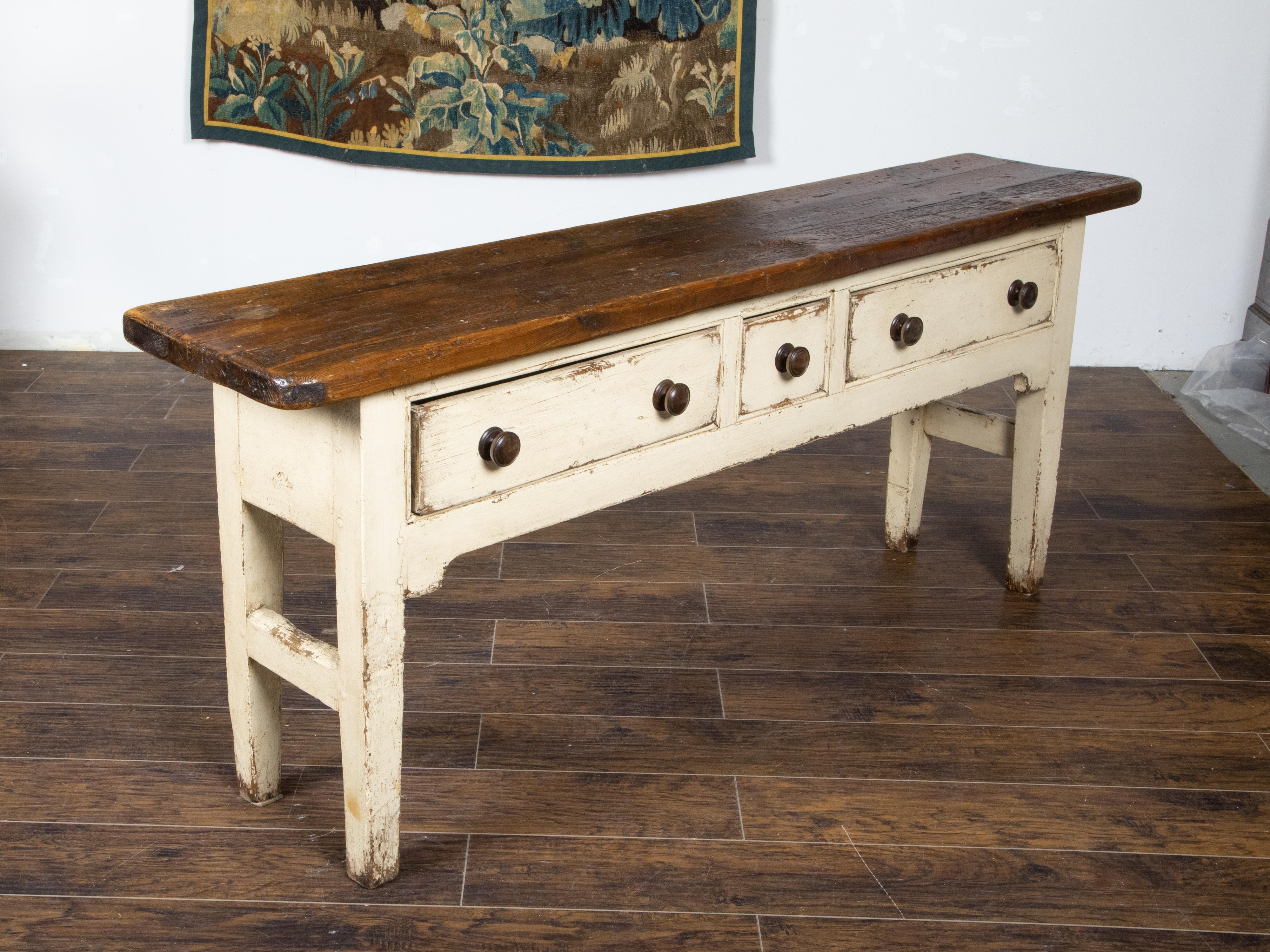 Wood English Rustic 20th Century Cream Painted Table with Brown Top and Three Drawers