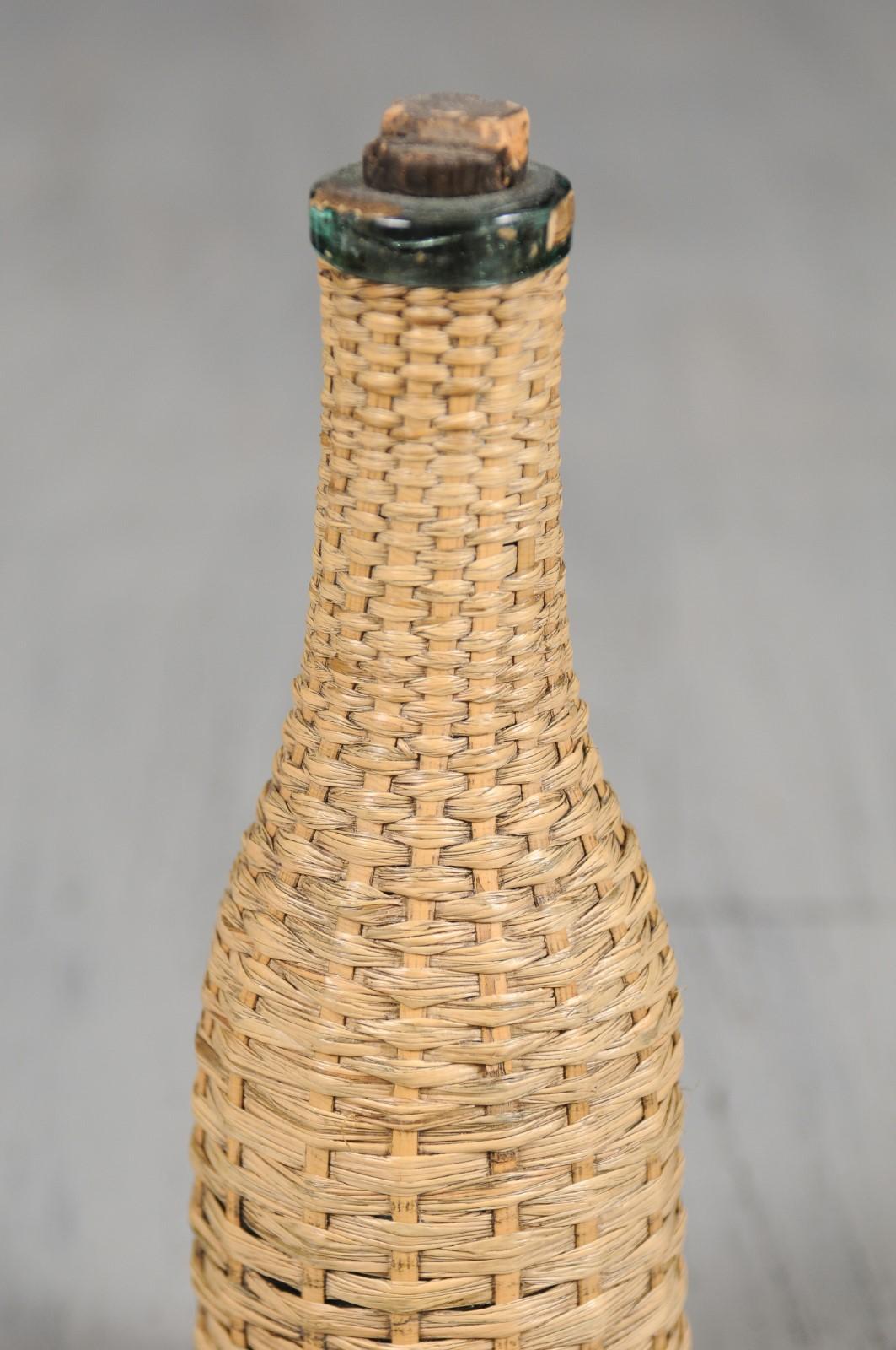 straw-covered bottle