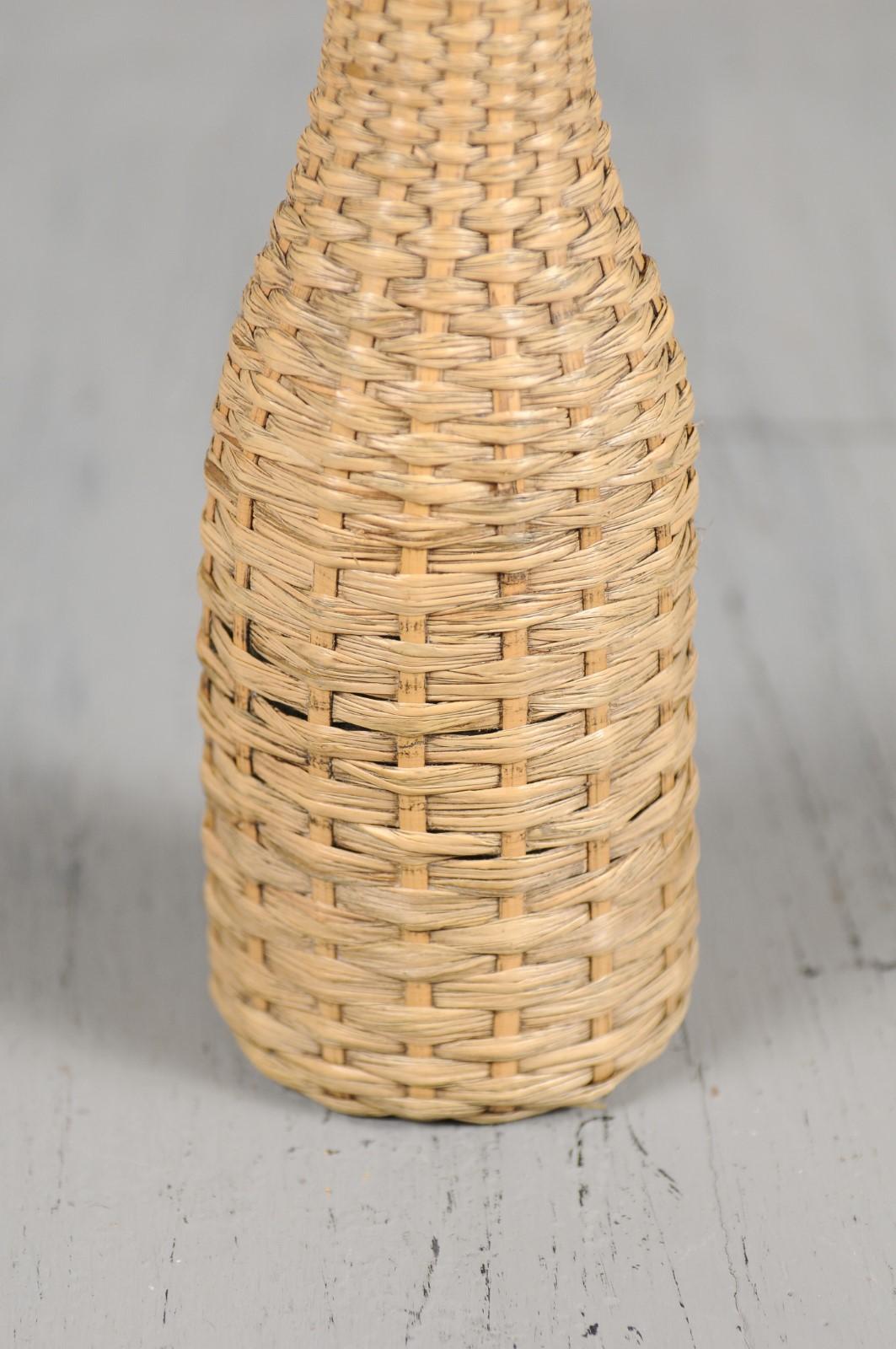 a straw covered bottle