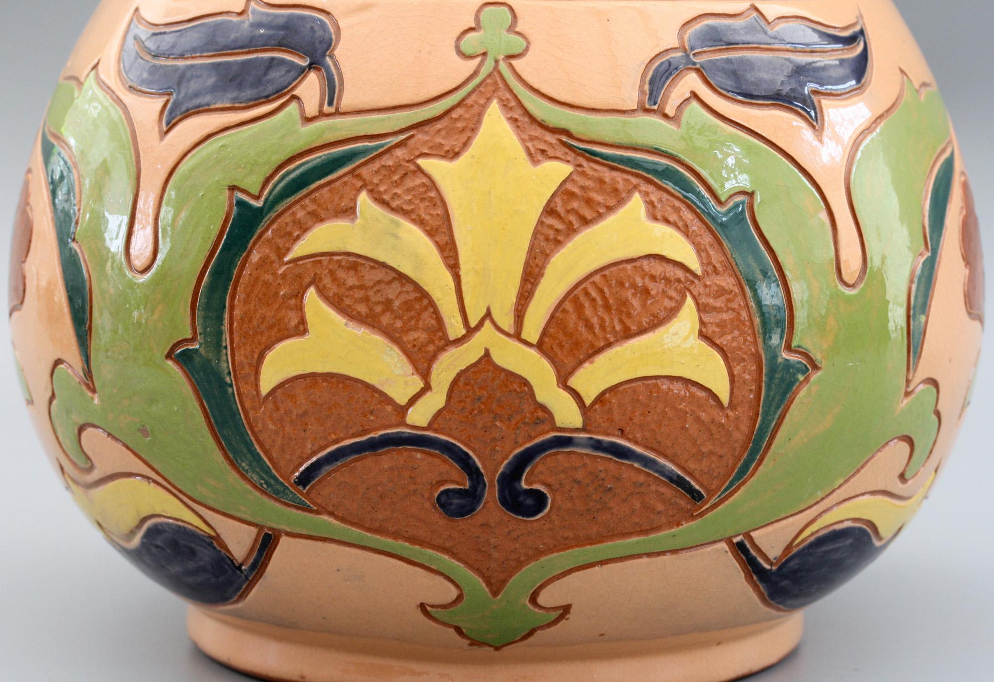 A fine Art Nouveau Salopian Rhodian Iznik pattern art pottery vase made at the Benthall Pottery Company around 1895. The red earthenware vase has a Middle Eastern shape standing on a narrow rounded foot with a rounded bulbous lower body tapering