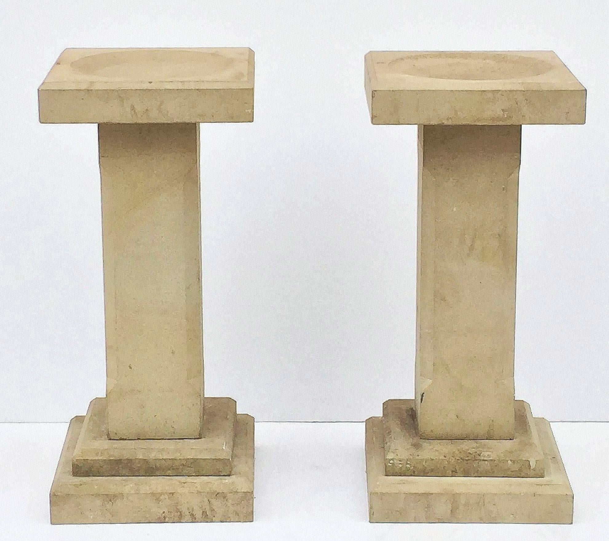 A pair of fine English garden bird baths of sandstone, each featuring a square top with round recessed bath area in the centre, set upon a chamfered column pedestal with square plinth base.

Dimensions:

H 33 1/4