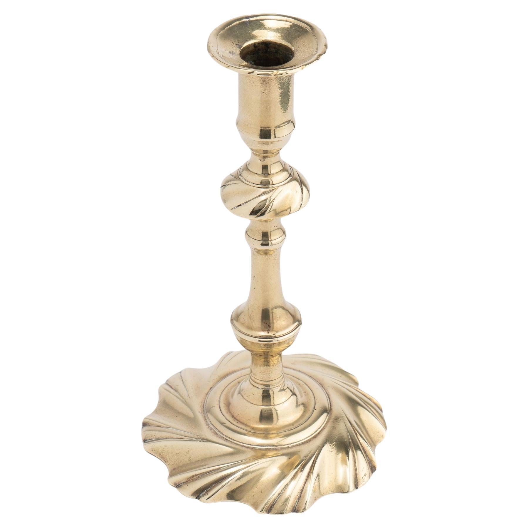 English seam cast brass swirl base candlestick, 1750 For Sale