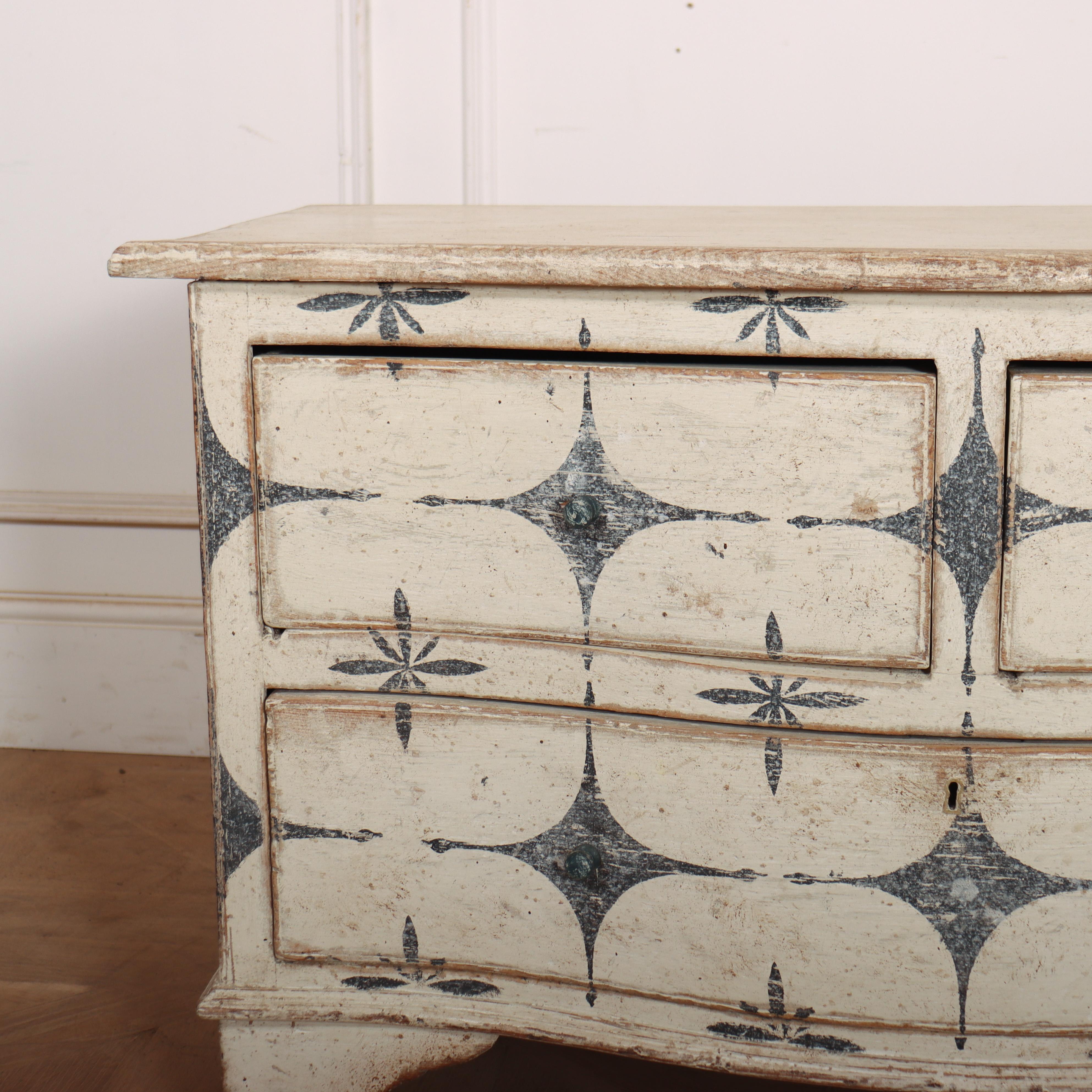 Low 19th century English serpentine painted pine commode with a decorative paint finish. 1830. 

Code: 9220

Dimensions:
W: 39