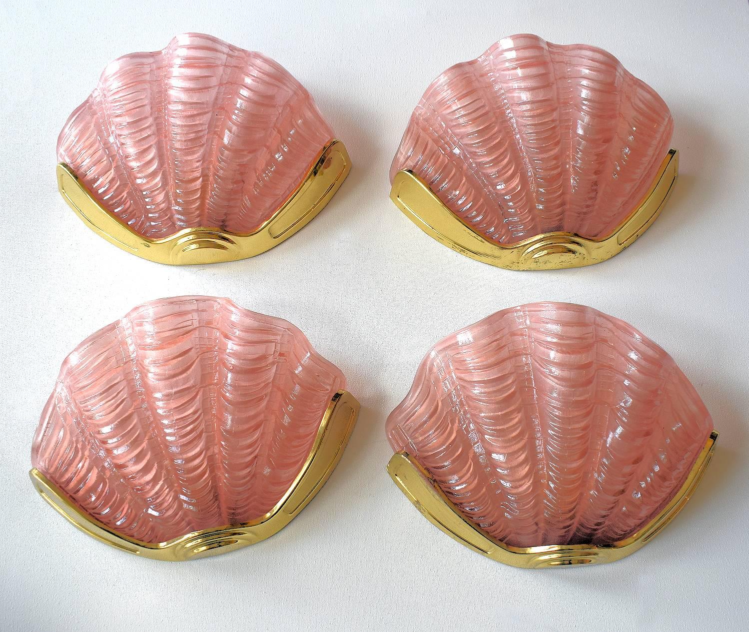 A beautiful matching set of four 1930s Art Deco wall lights of shell form. The gilt frames are in very good original condition which when fitted to the wall hold the beautiful soft pink glass shades firmly in place. Truly beautiful and will work