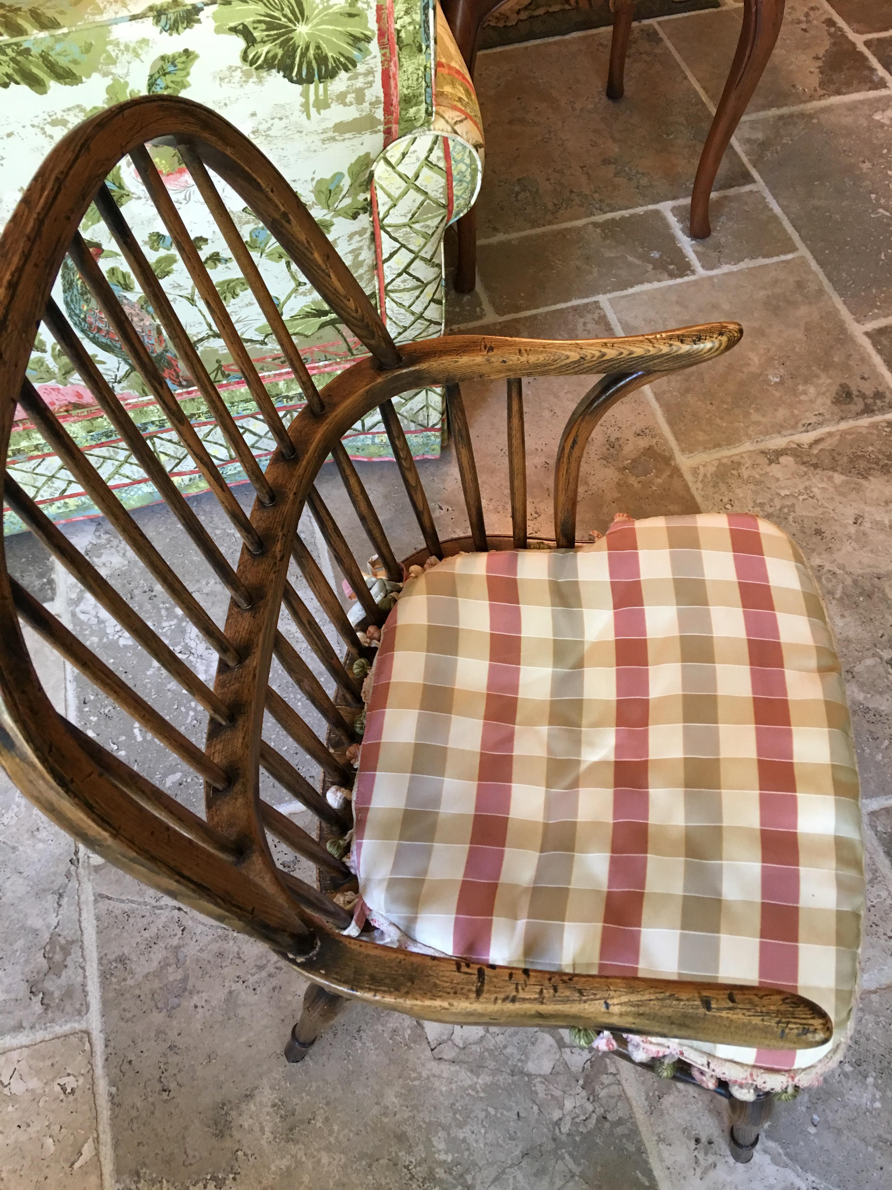 English set of four Windsor oak chairs, 20th century with custom made seat cushions.