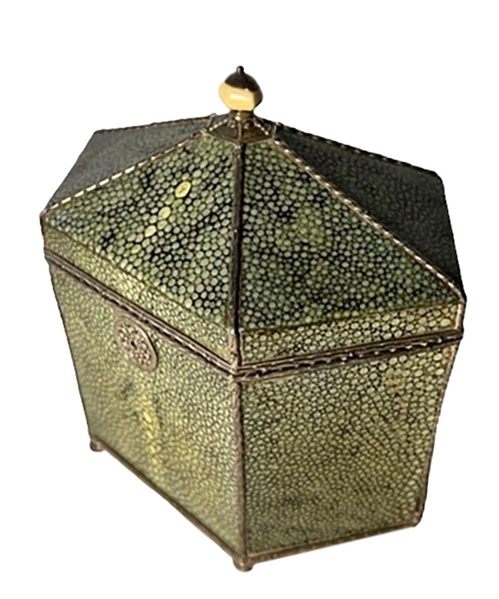 Antique English shagreen cased six sided wooden tea caddy with nice silver mounts, bone finial and undivided interior. Comes with small silver pin to unlock. Missing two of its small silver feet. Circa 19th century.
