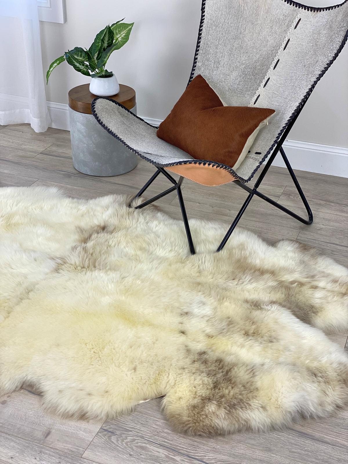Elevate your interiors with luxurious comfort found in this beautiful and divine, English Sheepskin Rug. Boasting with the most extraordinary natural color tones and markings, each Jacob sheepskin used has been individually selected and pre-matched