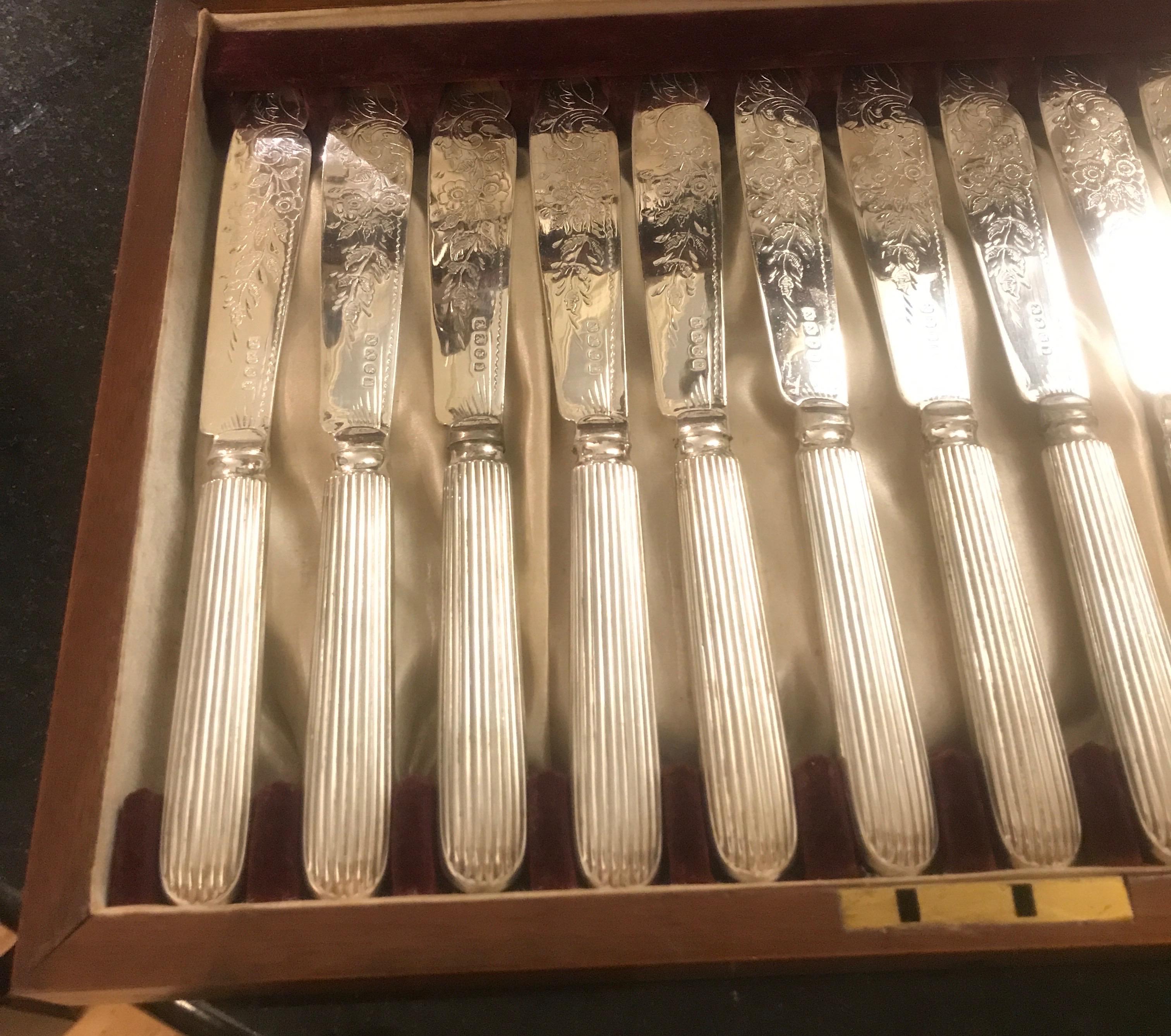 Elegant English Sheffield plate fish service for 12. The set in excellent condition with original storage box with silk satin lining. The set with delicate engraved design on the knife blades and showing the full set of English hallmarks.