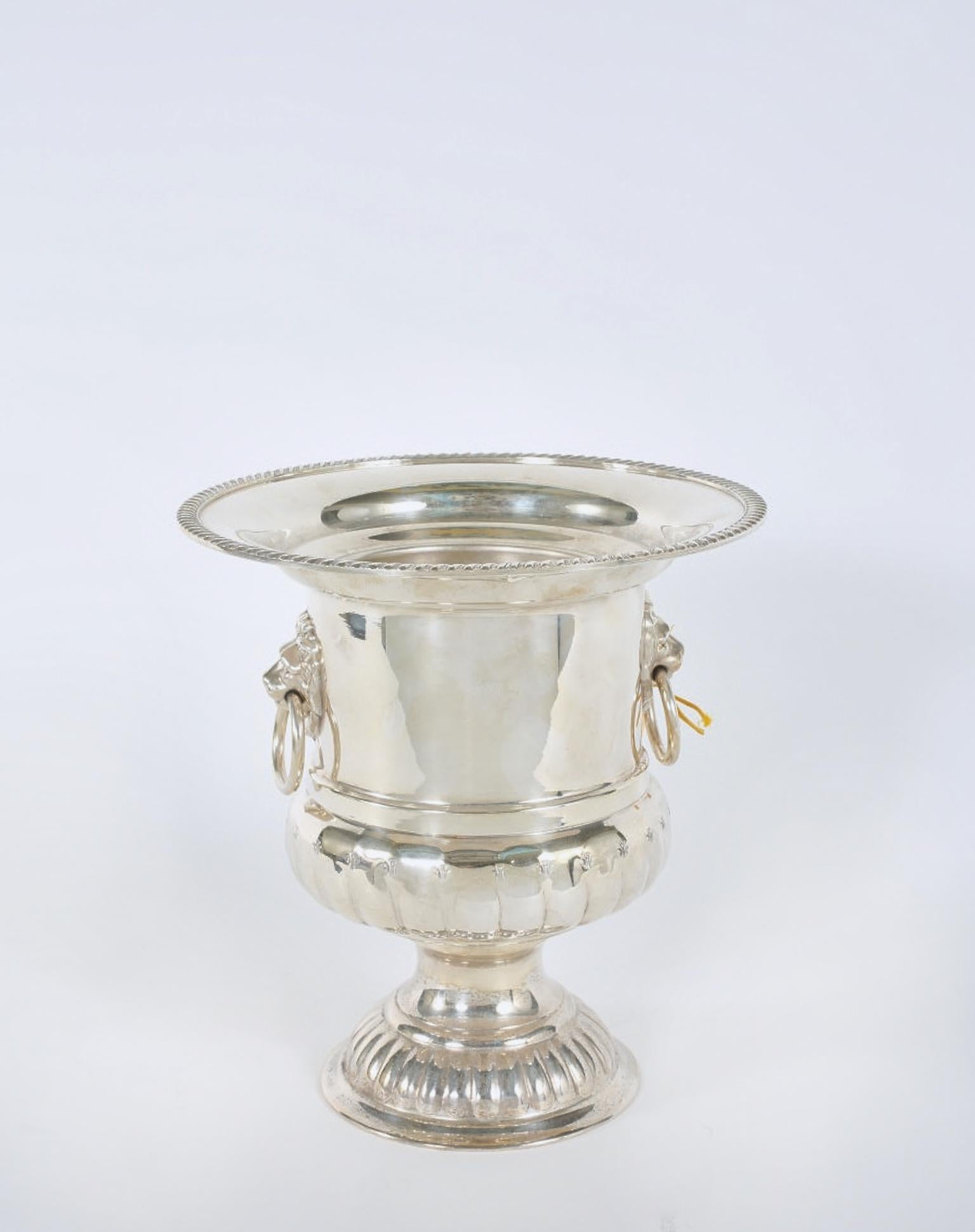 English Sheffield silver plated wine cooler / ice bucket with removable insert and lion head design details handle. Maker’s mark on bottom. The bucket is in good vintage condition with wear consistent with age / use. It measures: 10