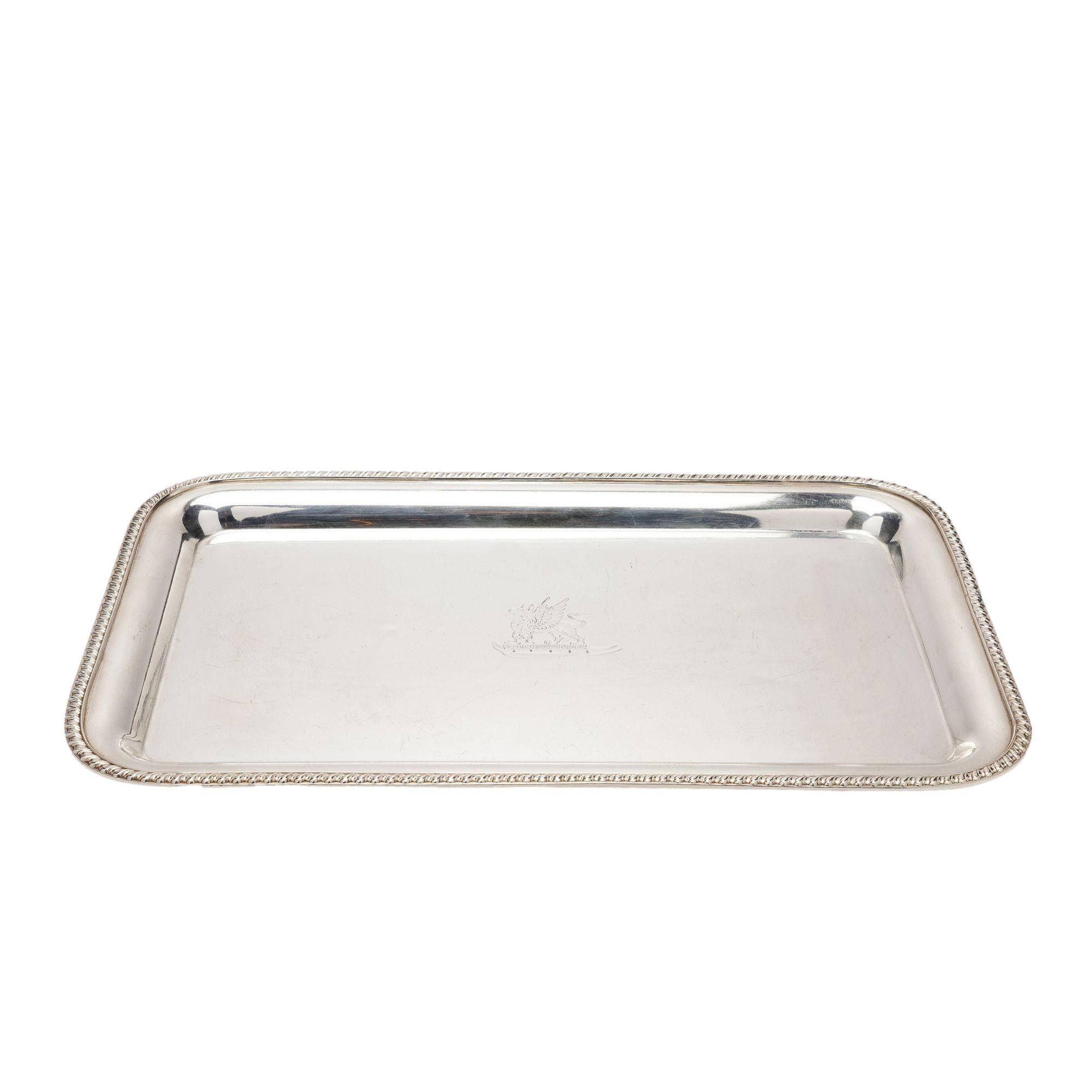 Vintage rectangular Sheffield tray in Britannia Silver with raised rolled border and gadroon edge. The tray is centered on an engraving of a griffin.
Impressed on the underside: England

Sheffield, England, circa 1890-1893.