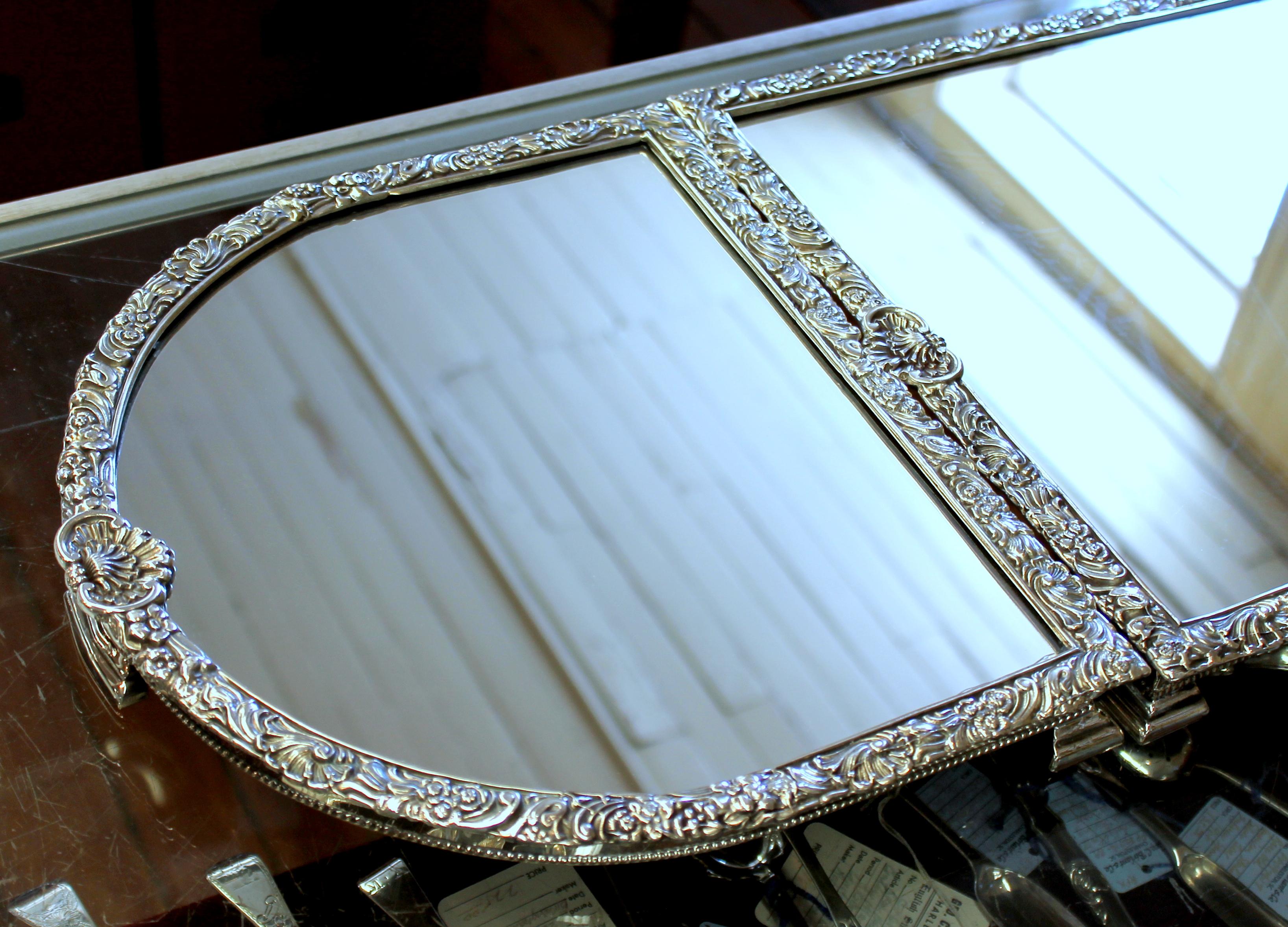 Finest quality reproduction English Sheffield silver-plate Rococo style three-section mirror plateau
-Antique copy- Made in Sheffield, England.

Fabulous early 19th century style applied Rococo mounted border and 