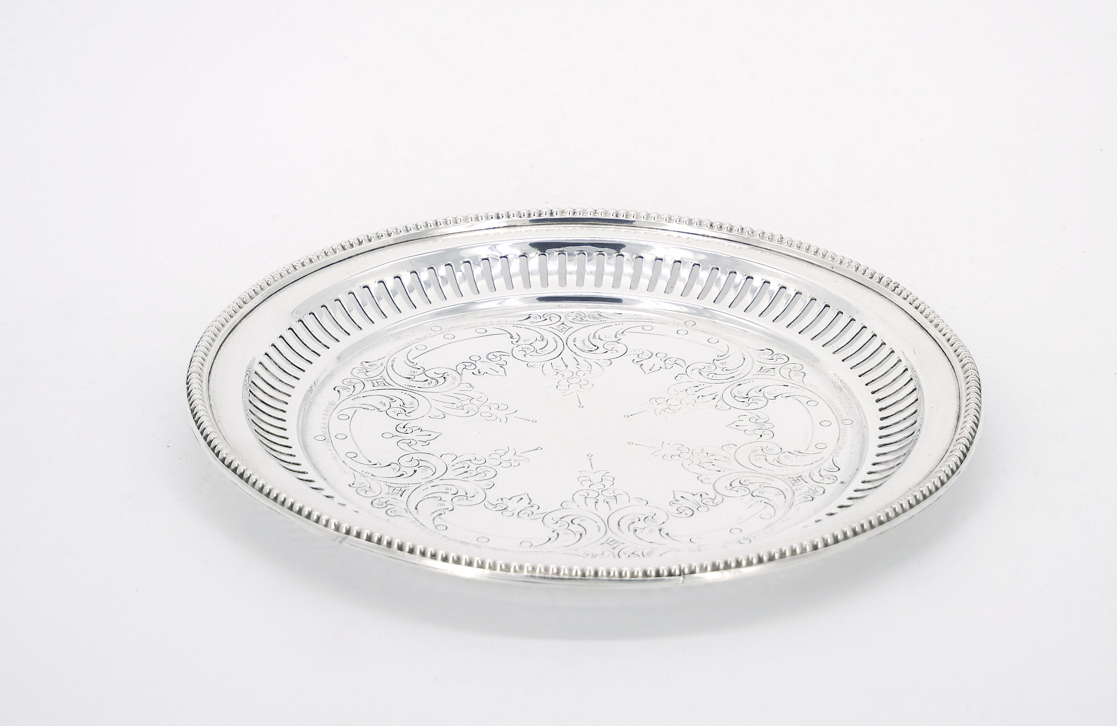 
Enhance your dining or bar experience with our exquisite Sheffield silver plate round shape footed serving tray. This  elegant piece combines timeless craftsmanship with intricate interior hand engraved design details, Creating a stunning focal