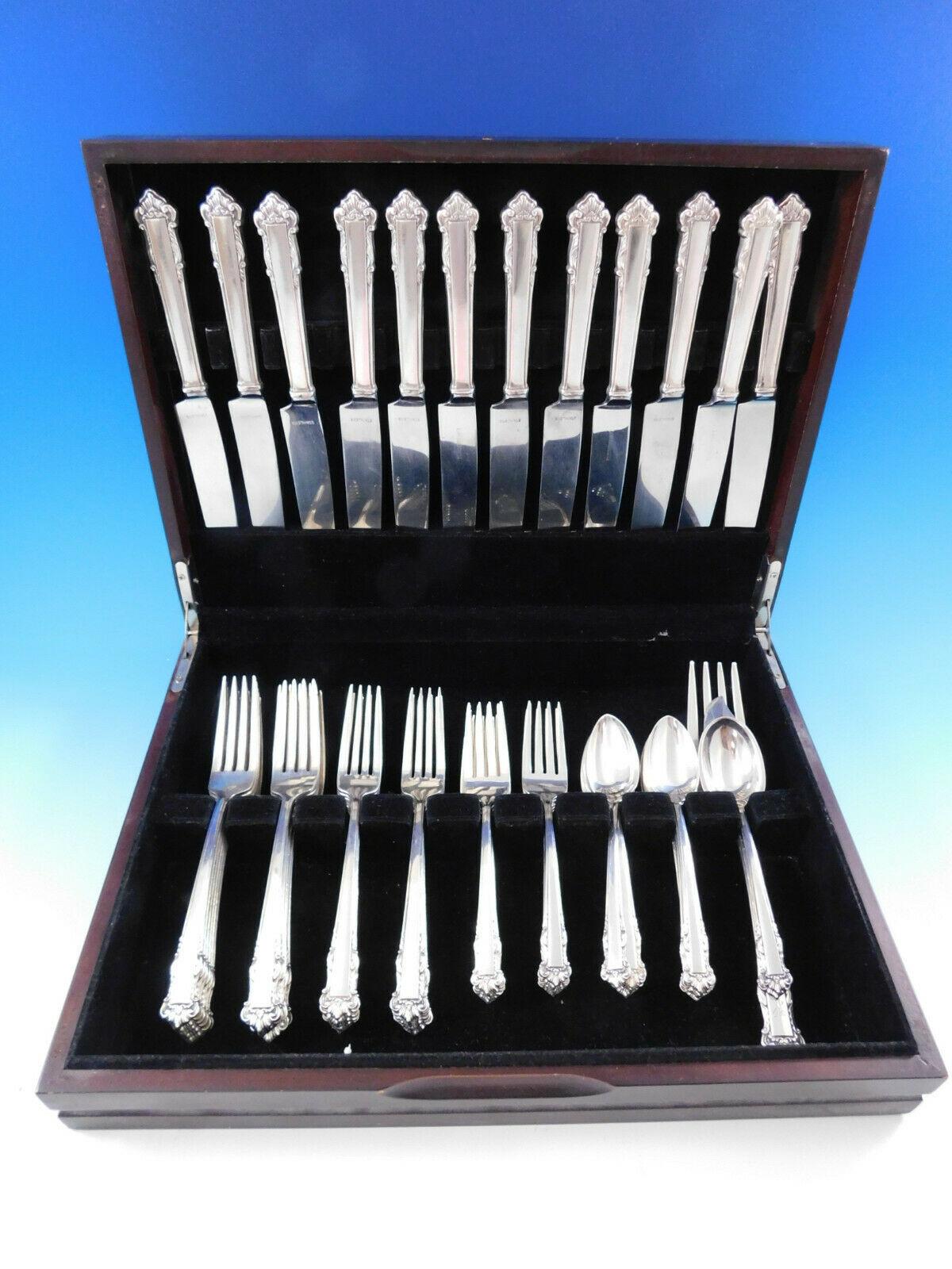 Dinner size English shell by Lunt sterling silver flatware set, 63 pieces. This set includes:

Condition12 dinner size knives, 9 1/2