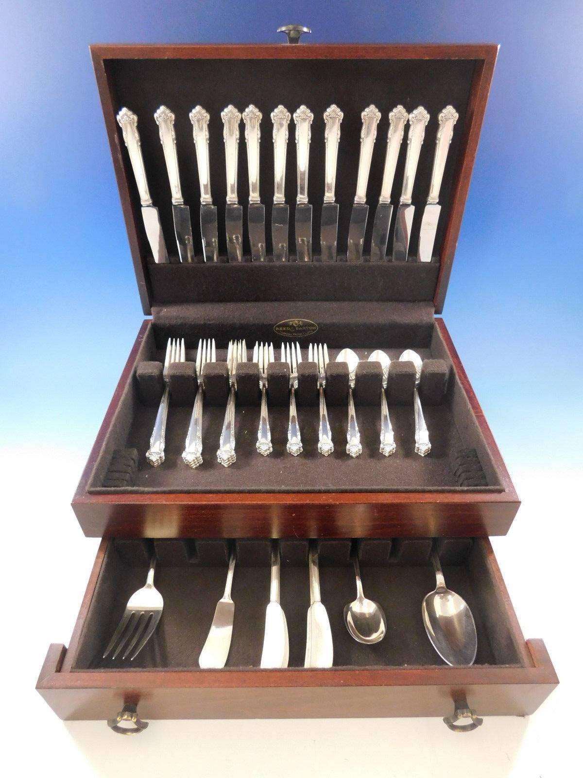 English shell by Lunt sterling silver flatware set, 64 pieces. This set includes:

12 knives, 8 7/8
