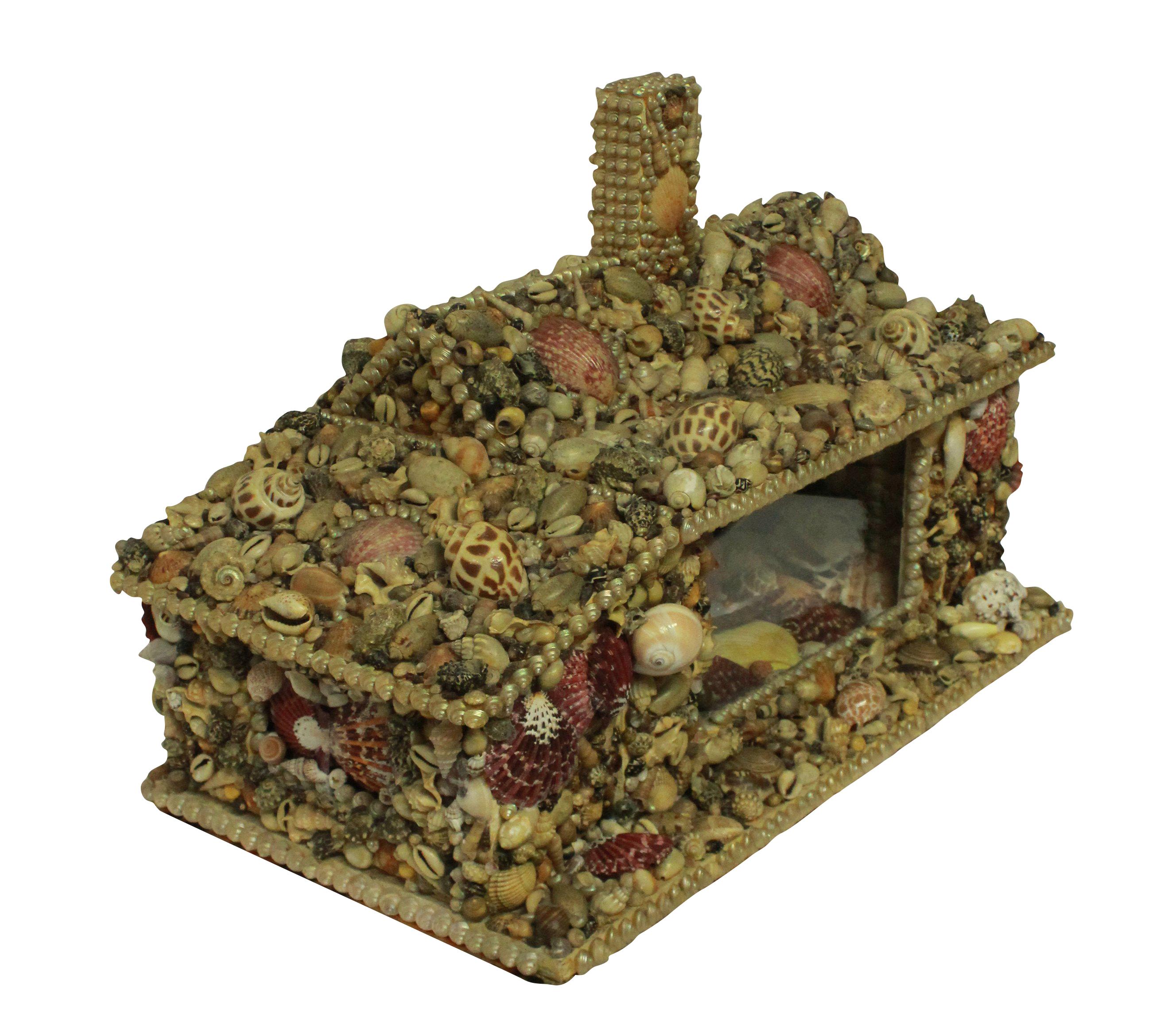 An English shell grotto modelled on a cottage, with doors and a glazed window with mirror interior. Nicely worked throughout with no losses.