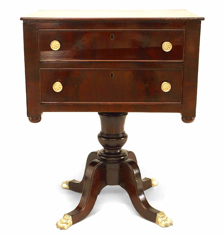 English Sheraton style (19th century) mahogany pedestal base end table with two drawers.

       