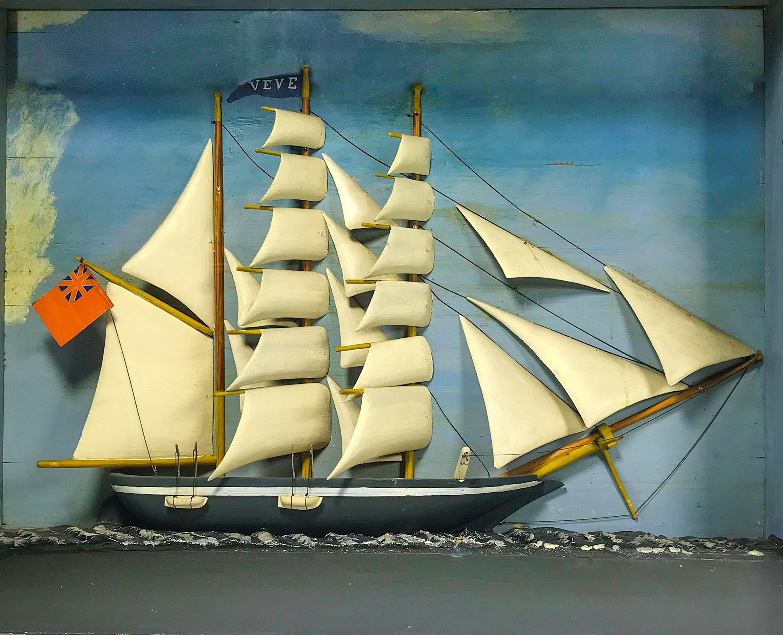 Of the three mast schooner “Veve”, carved hull
and sails. Hanging the British flag with painted
backboard and mounted on a wooden base with
painted plaster see. The frame is grain painted
yellow and brown, English, circa 1890-1910.
Measures: