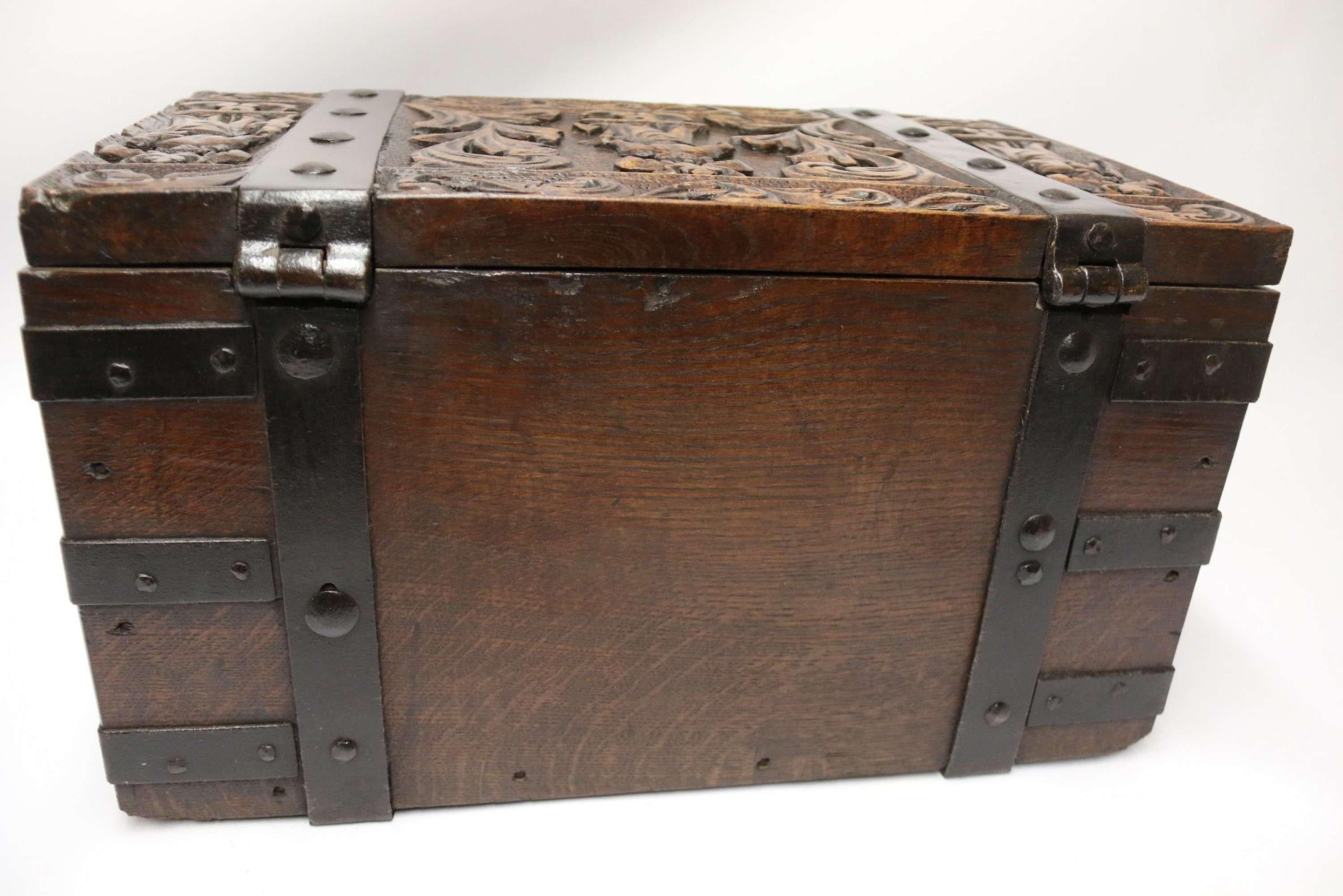 A Rare Ships or Country House Carved Oak and Steel Bound Strong Box

This fabulous and richly carved oak strong box most likely belonged to a 19th century ship’s captain and was used for storing money and valuables. It is of a smaller size than the