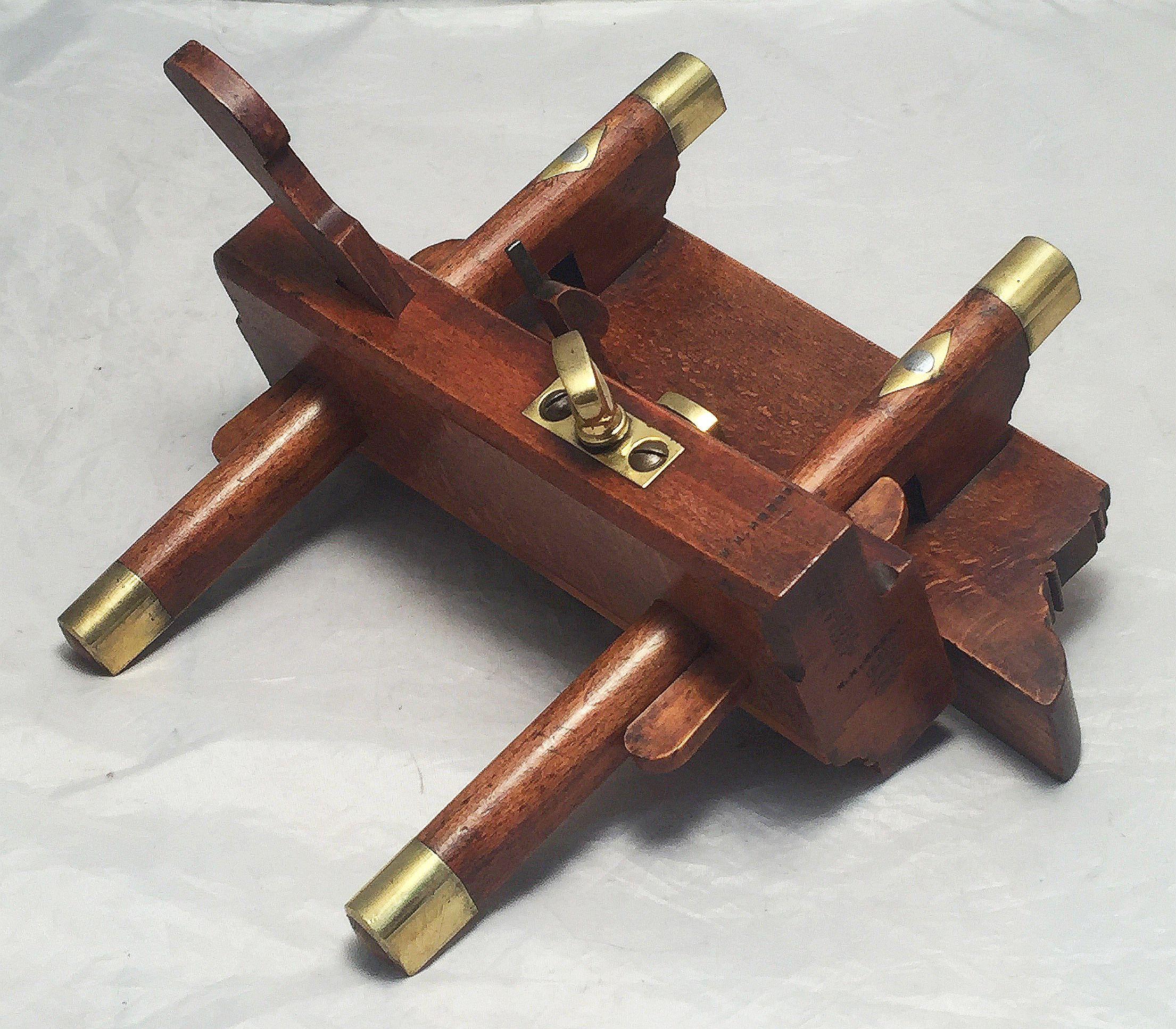 A fine English shipwright's or carpenter's sash fillister or plough plane, c.1900, of finely patinated beech wood and brass by Atkin and Sons, Sheffield Works, Birmingham
Marked A & S, Benefactum

The British wooden sash fillister plane is a