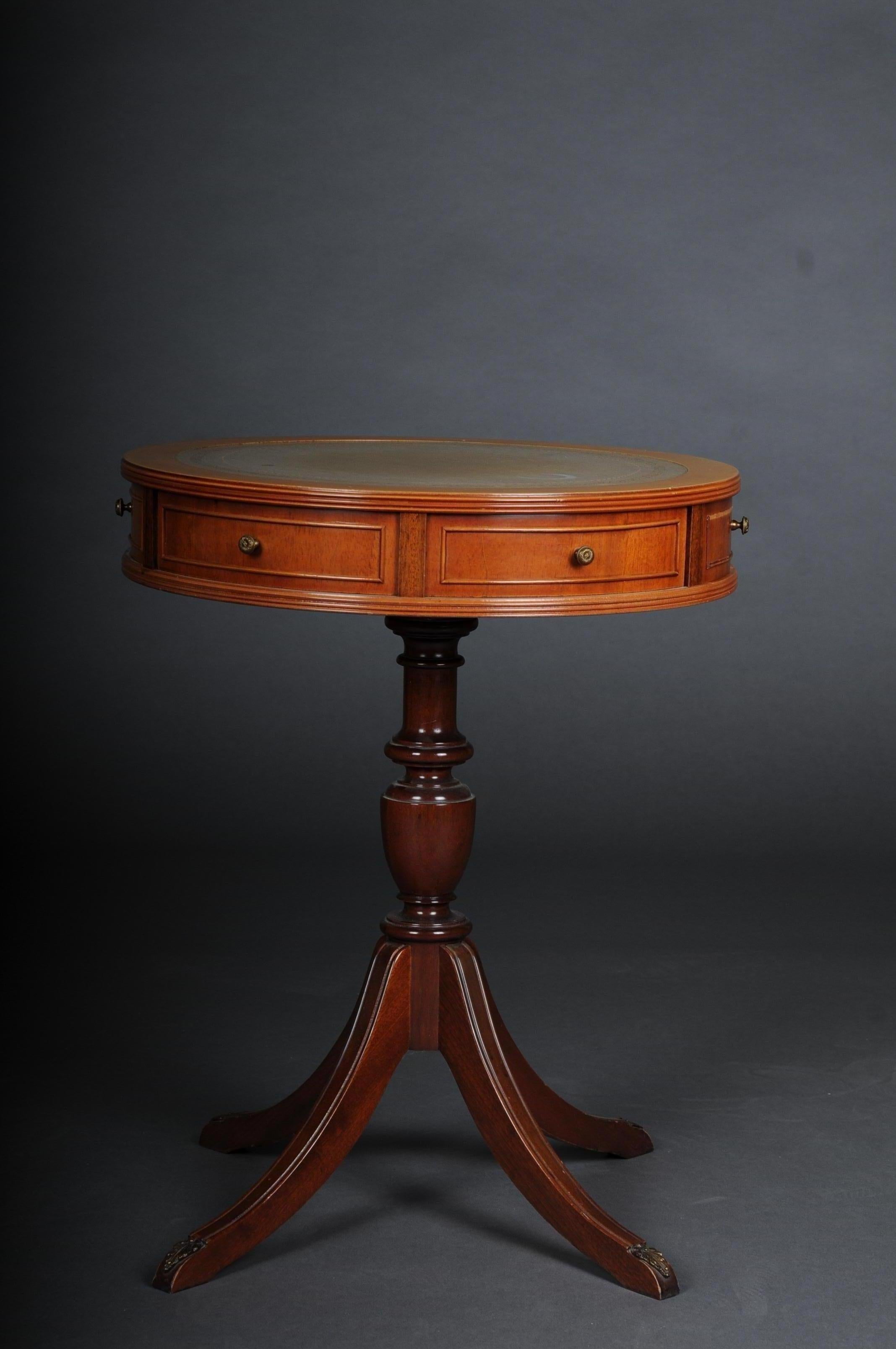 English side table / table, 20th century

Solid wood stained with mahogany. English side table, 20th century 19th century, Victorian. Round top with 2 drawers. Round cover plate on profiled balustrade shaft ending on four curved feet. Green