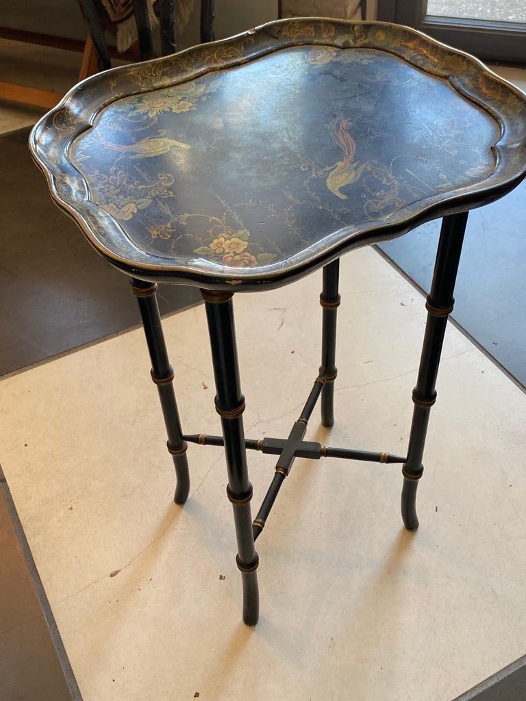 This English SIDE TABLE was made by Dextel in the 1950's  black lacquered faux bamboo design hand painted birds and flowers with a scalloped edge to the top