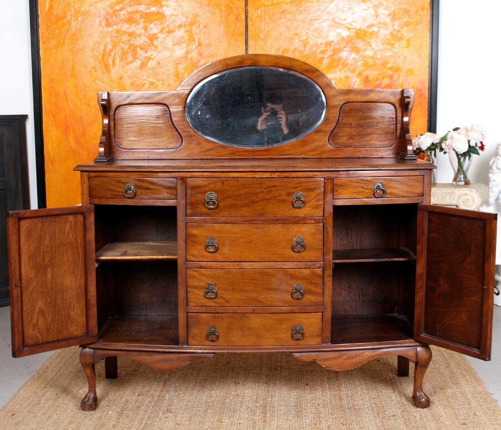 A fine quality 19th century sideboard in the Arts & Crafts manner.
The mahogany boasting a well figured grain and rich patina.
The carved upstand above the rectangular top with carved edges and beveled mirror above a column of four drawers flanked