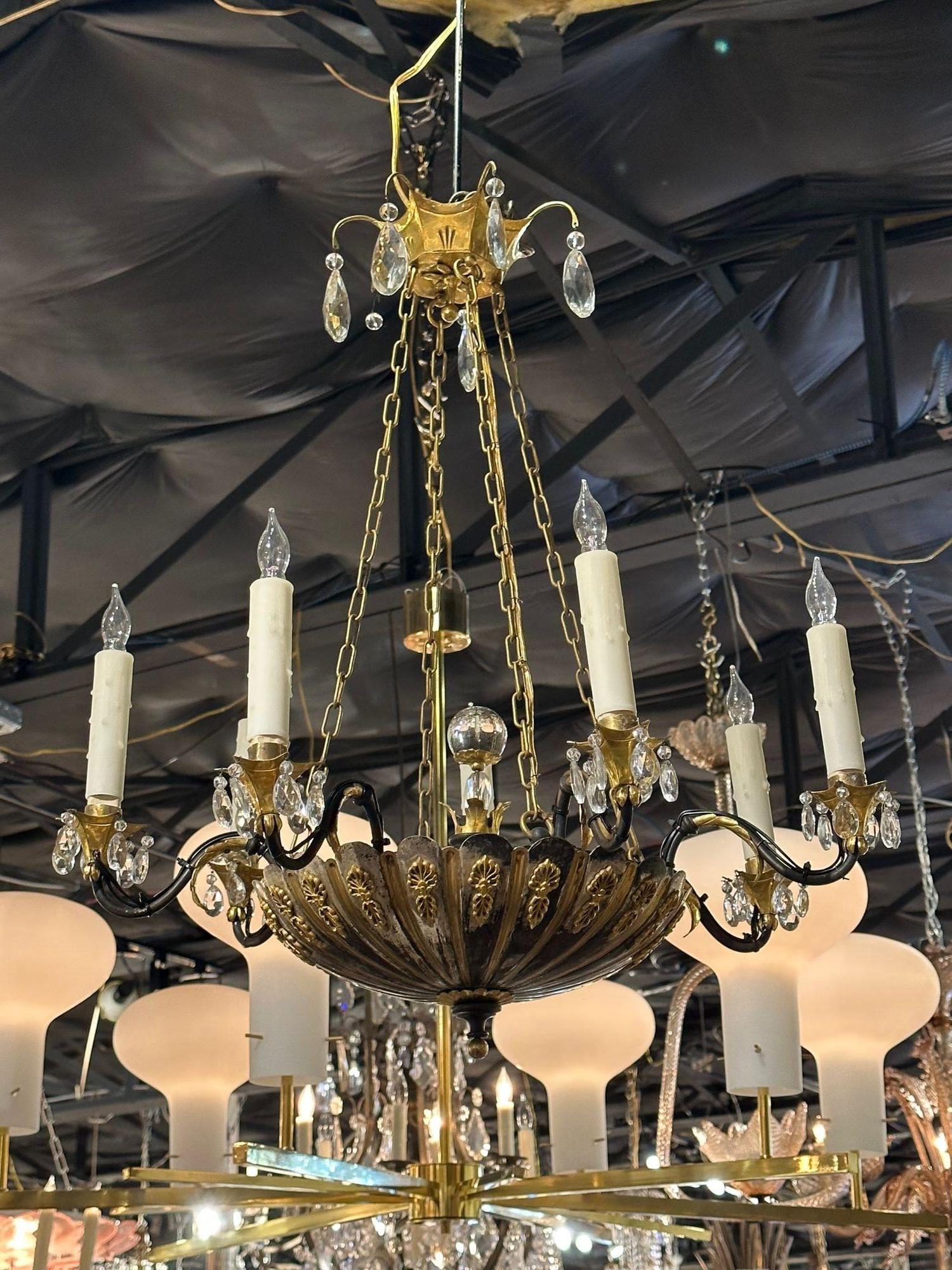 19th century English silver and bronze chandelier. Circa 1880. The chandelier has been professionally rewired, comes with matching chain and canopy. It is ready to hang!