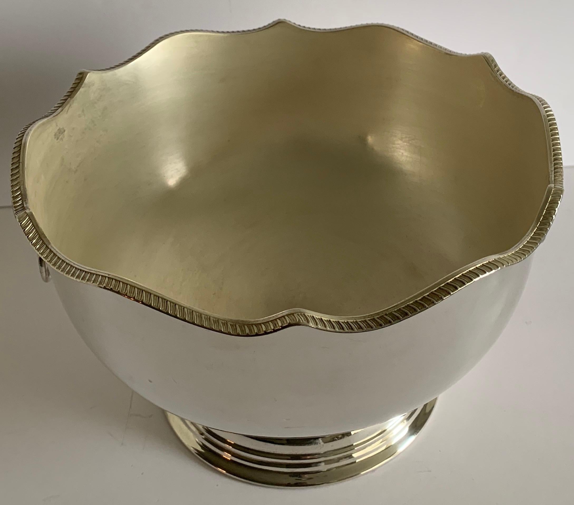 Large English silver plated monteith or punch bowl. Lion head detailing. Newly re-plated and polished to a high shine. No makers mark or hallmarks.
